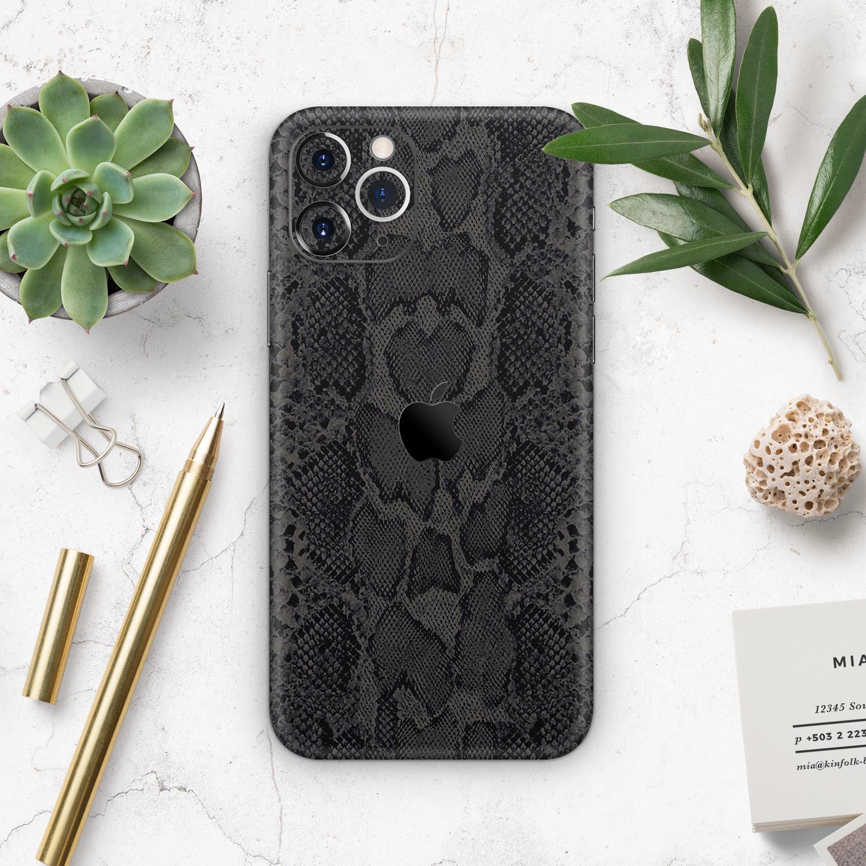 Black Snake Skin v2 skin for Apple iPhone 14, showcasing a stylish snake skin pattern with a glossy finish.