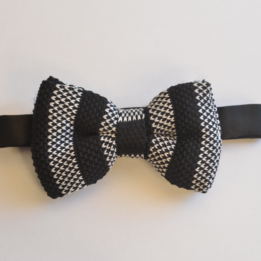 Elegant black stripe and white detail knitted bow tie, pre-tied and adjustable for all sizes, made from durable polyester.