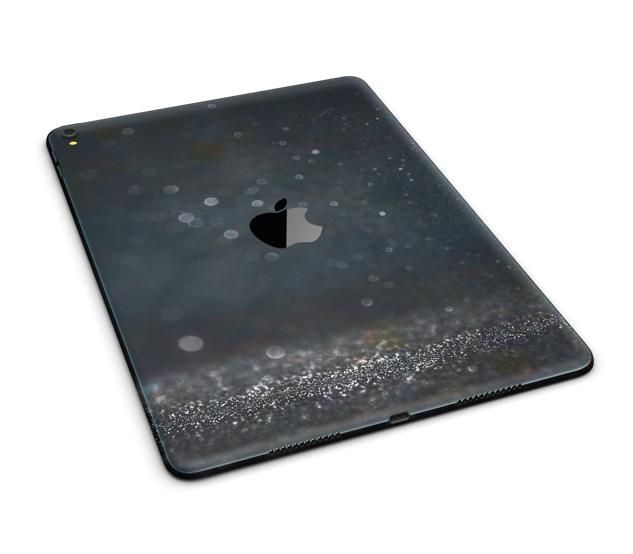 Black Unfocused Glowing Shimmer Full Body Skin for iPad Pro, showcasing its sleek design and premium vinyl material.