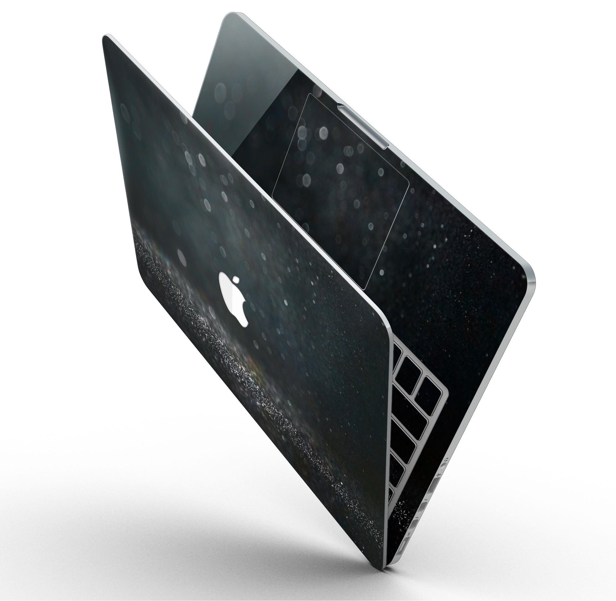 Black Unfocused Glowing Shimmer skin applied to a MacBook Pro with Retina Display, showcasing its sleek design and vibrant colors.