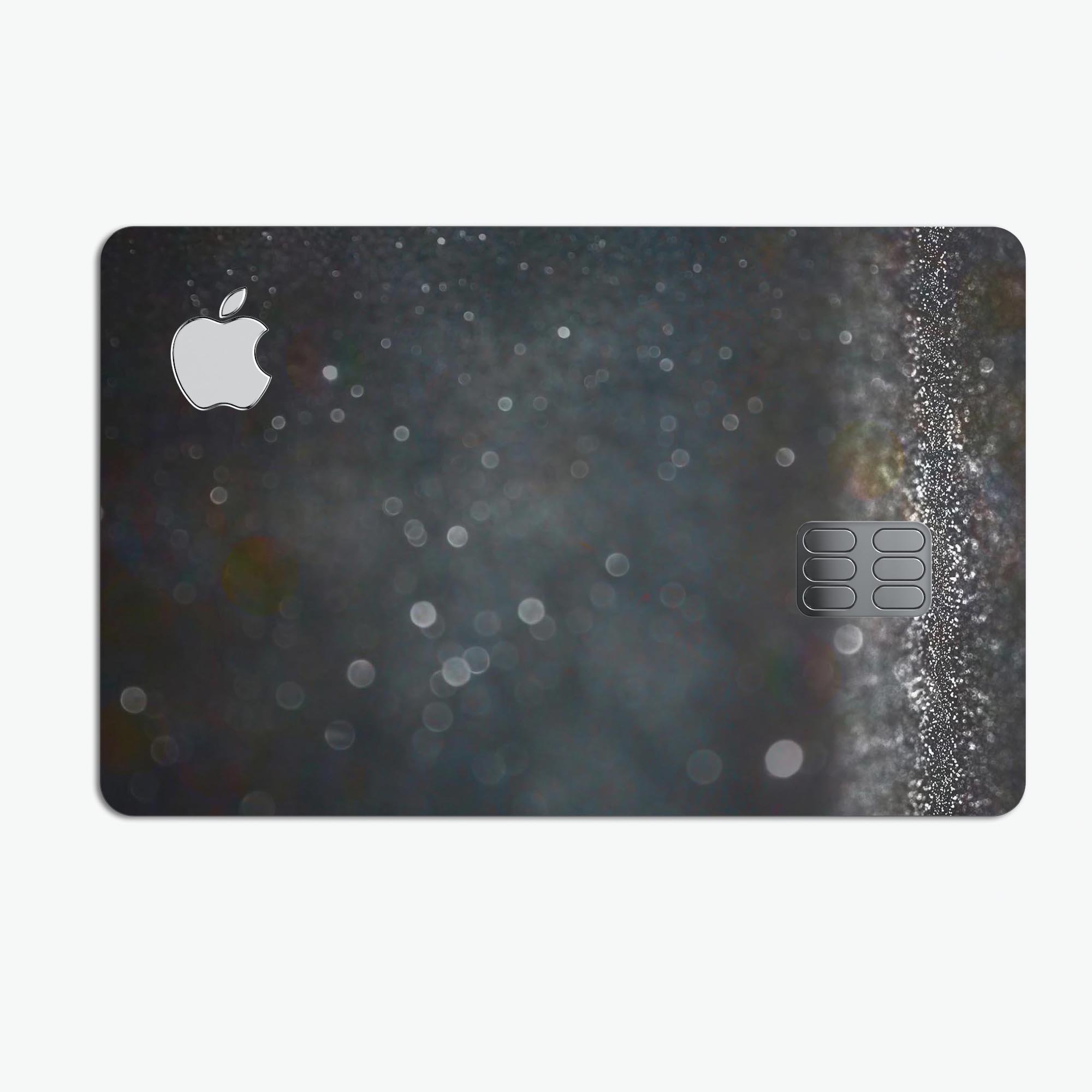 Black Unfocused Glowing Shimmer skin for Apple Card, showcasing its premium vinyl texture and stylish design.