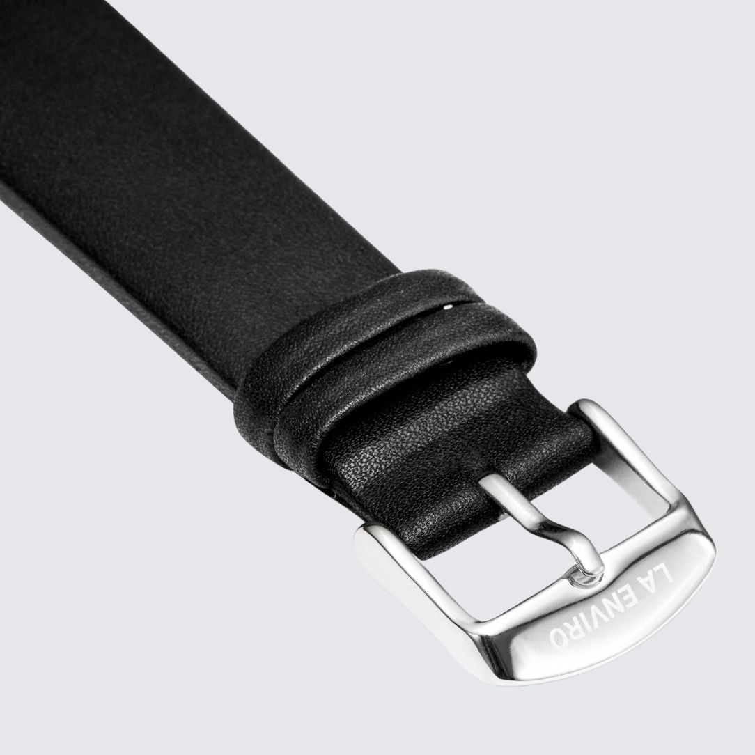 Black unstitched vegan leather watch strap with quick release pin and stainless steel buckle options.