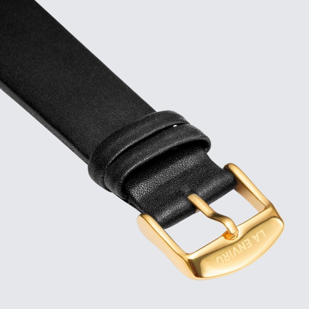 Black unstitched vegan leather watch strap with quick release pin and stainless steel buckle options.