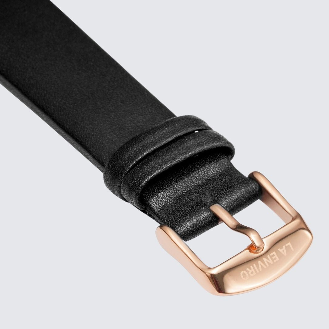 Black unstitched vegan leather watch strap with quick release pin and stainless steel buckle options.