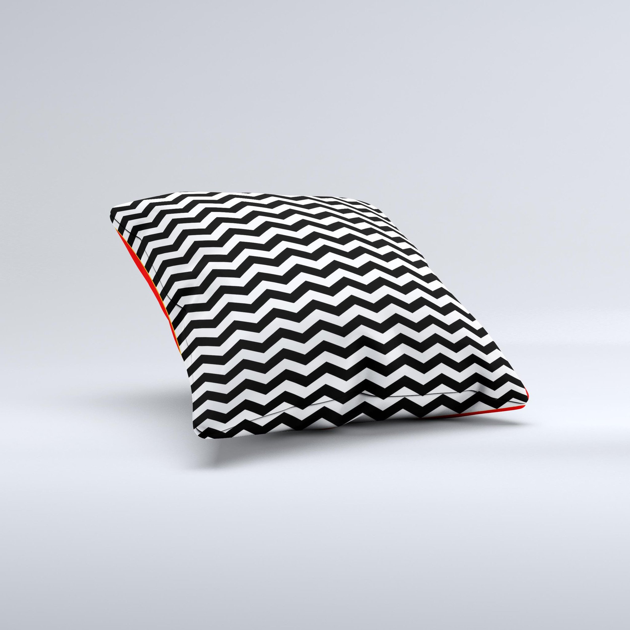 Black and white chevron pattern decorative throw pillow, handcrafted with high-quality materials, showcasing unique design imperfections.