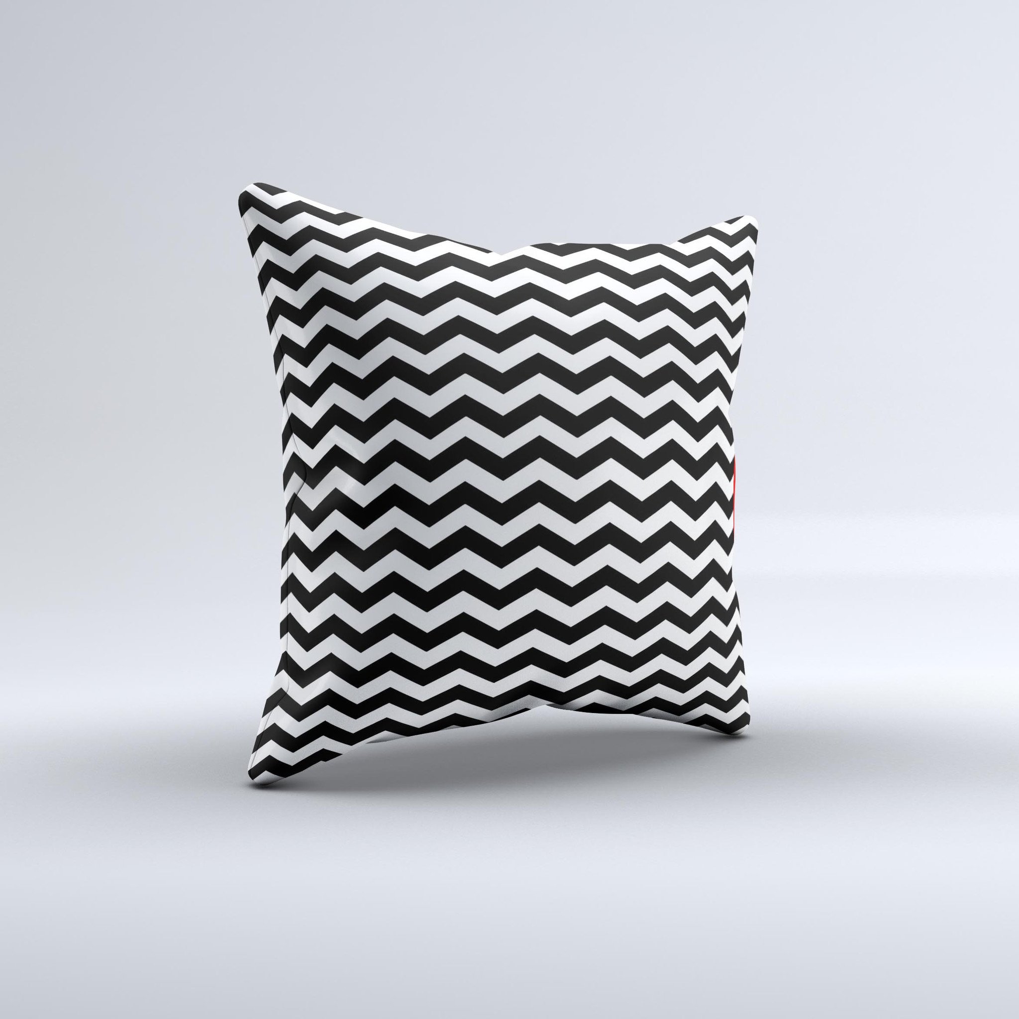 Black and white chevron pattern decorative throw pillow, handcrafted with high-quality materials, showcasing unique design imperfections.