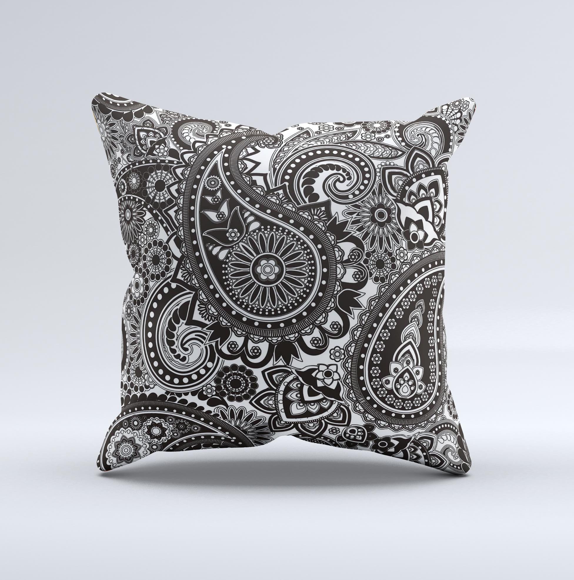 Black and white decorative throw pillow featuring a paisley pattern, showcasing intricate designs and high-quality fabric.