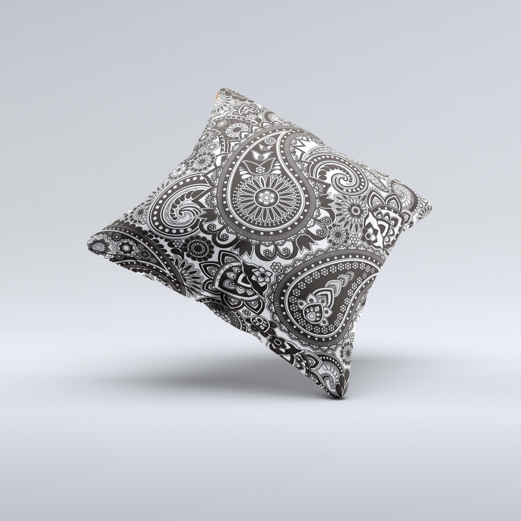 Black and white decorative throw pillow featuring a paisley pattern, showcasing intricate designs and high-quality fabric.