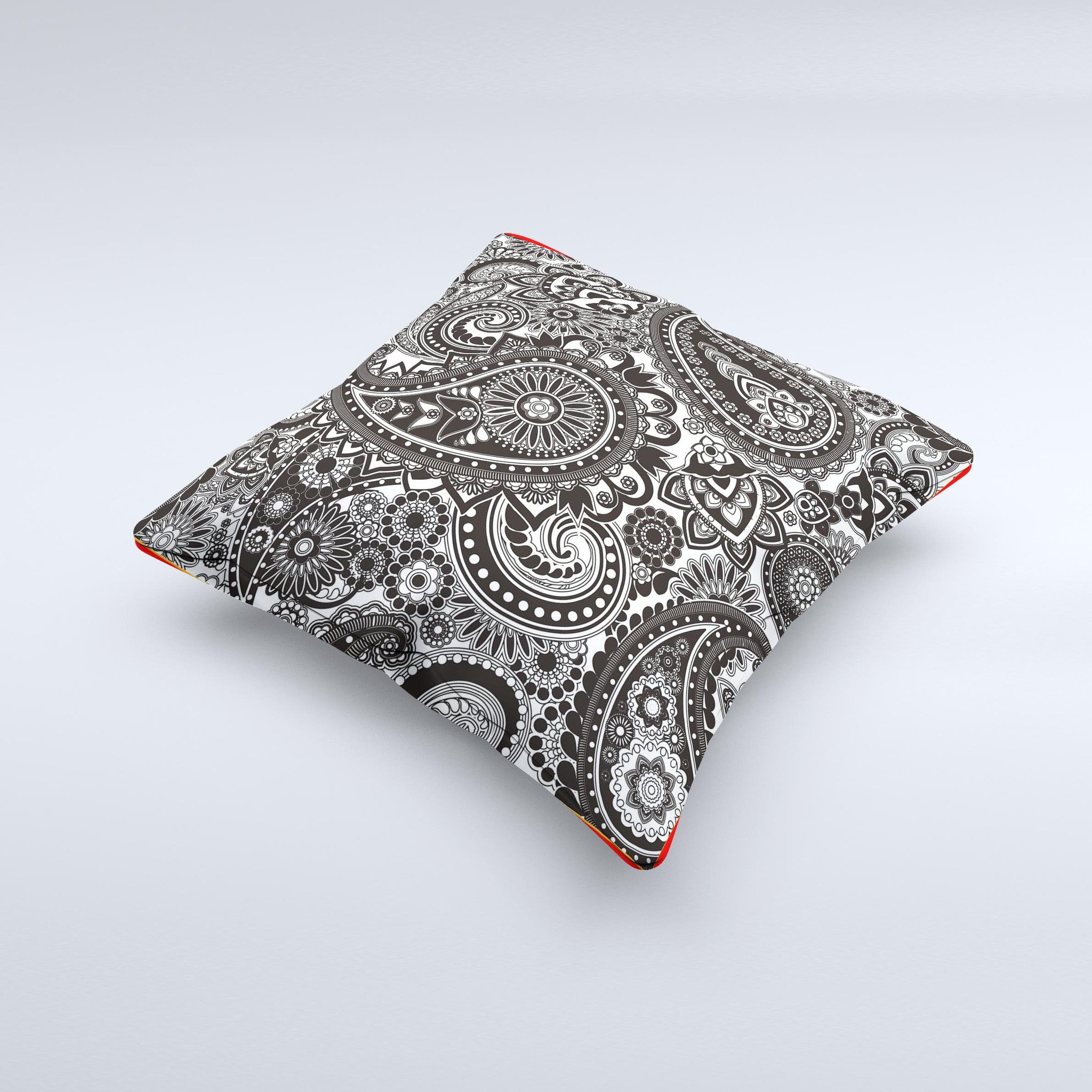 Black and white decorative throw pillow featuring a paisley pattern, showcasing intricate designs and high-quality fabric.