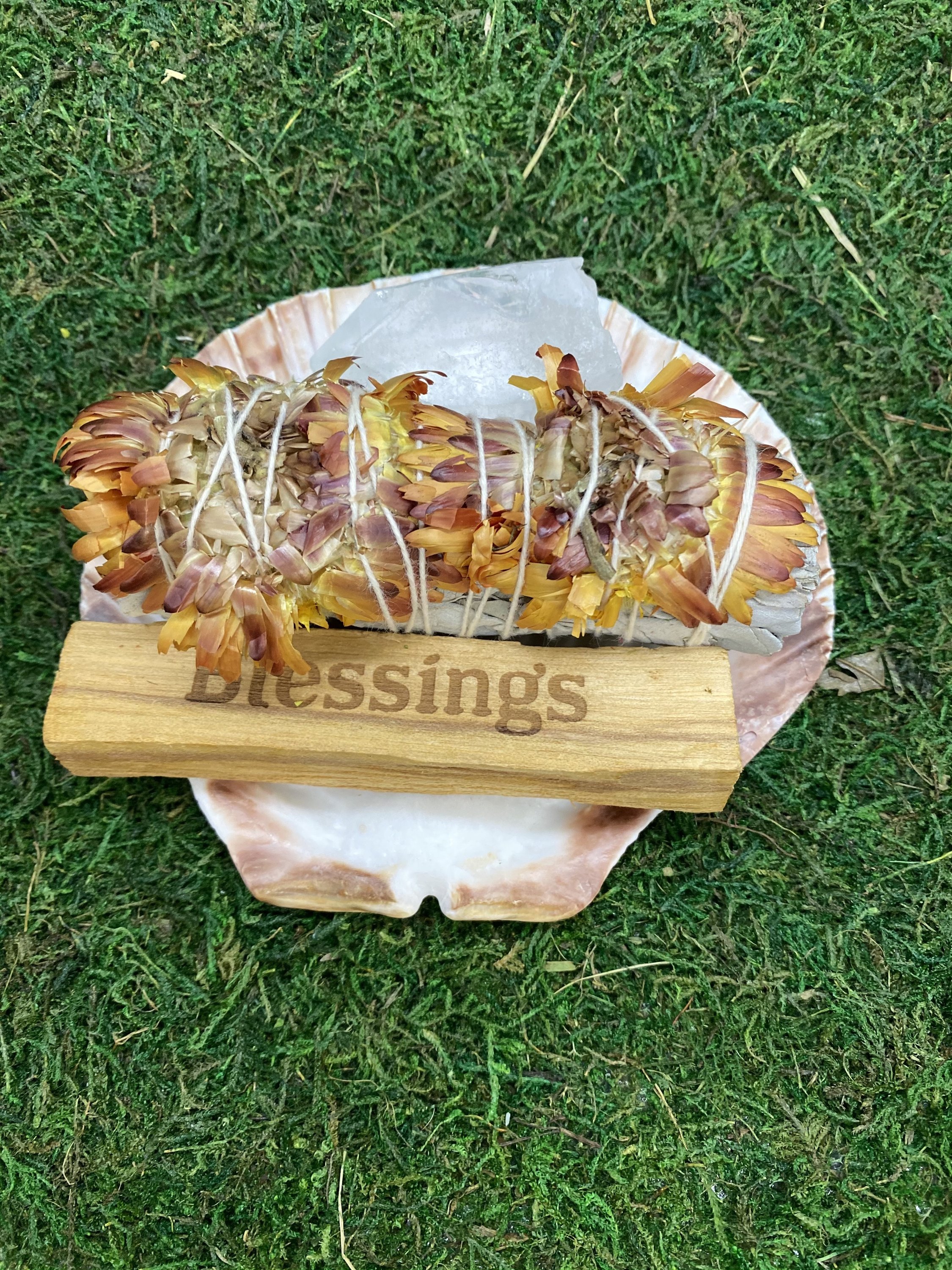 Blessing Smudge Kit featuring Clear Quartz, Palo Santo stick, Floral Sage stick, and a decorative shell for catching embers.