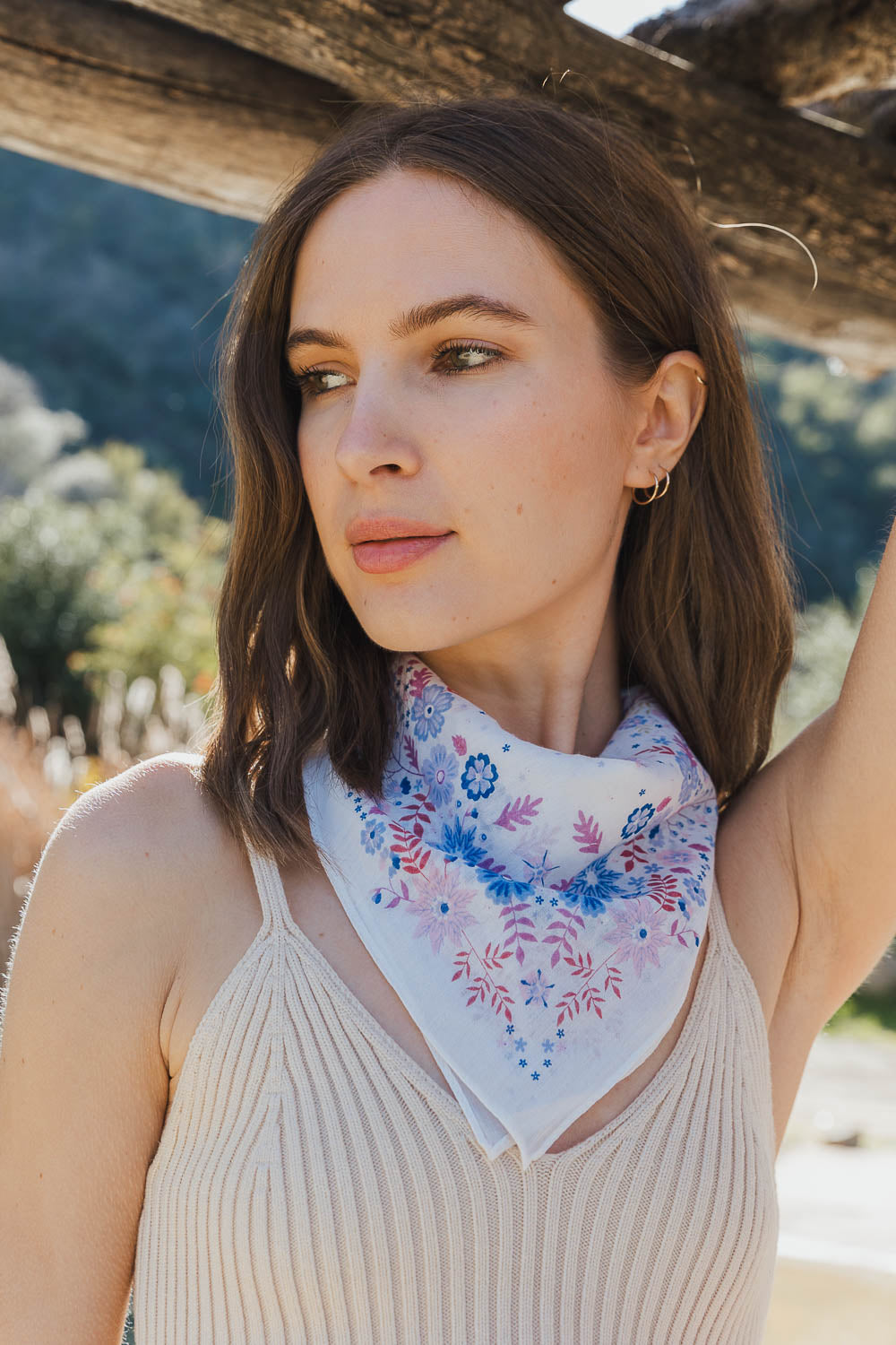 A vibrant Blissful Bloom Floral Bandana featuring a colorful floral pattern, perfect for summer and festivals.