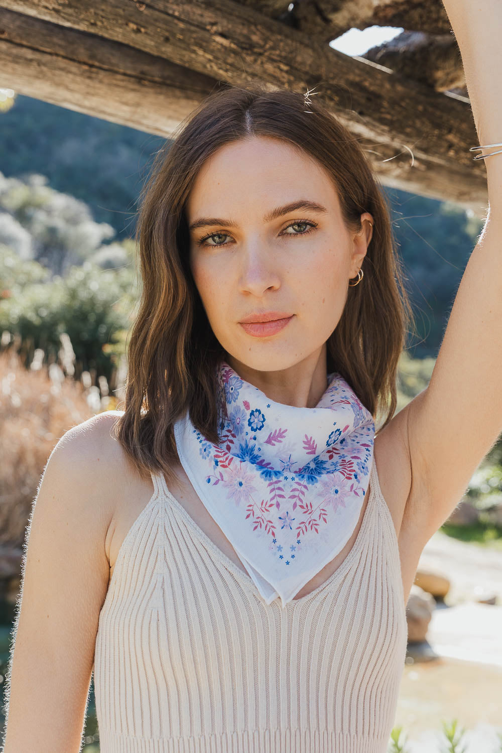 A vibrant Blissful Bloom Floral Bandana featuring a colorful floral pattern, perfect for summer and festivals.