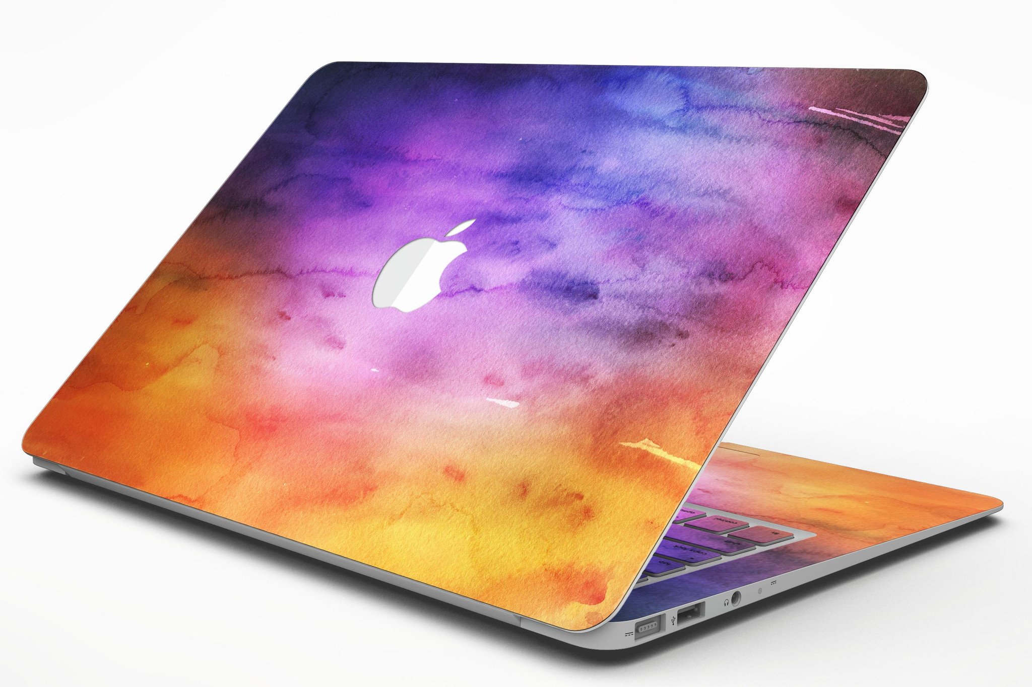 Blotted 6482 Absorbed Watercolor Texture skin applied to a MacBook Air, showcasing vibrant colors and a sleek design.