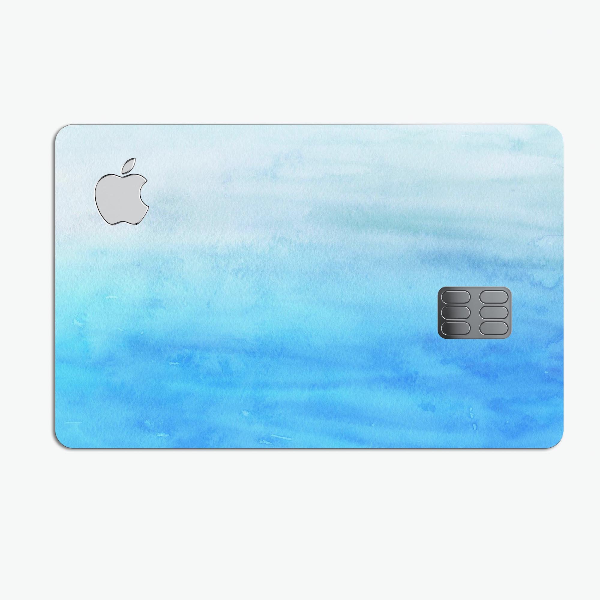 Blotted Blues Absorbed Watercolor Texture decal on an Apple Card, showcasing vibrant colors and a protective design.