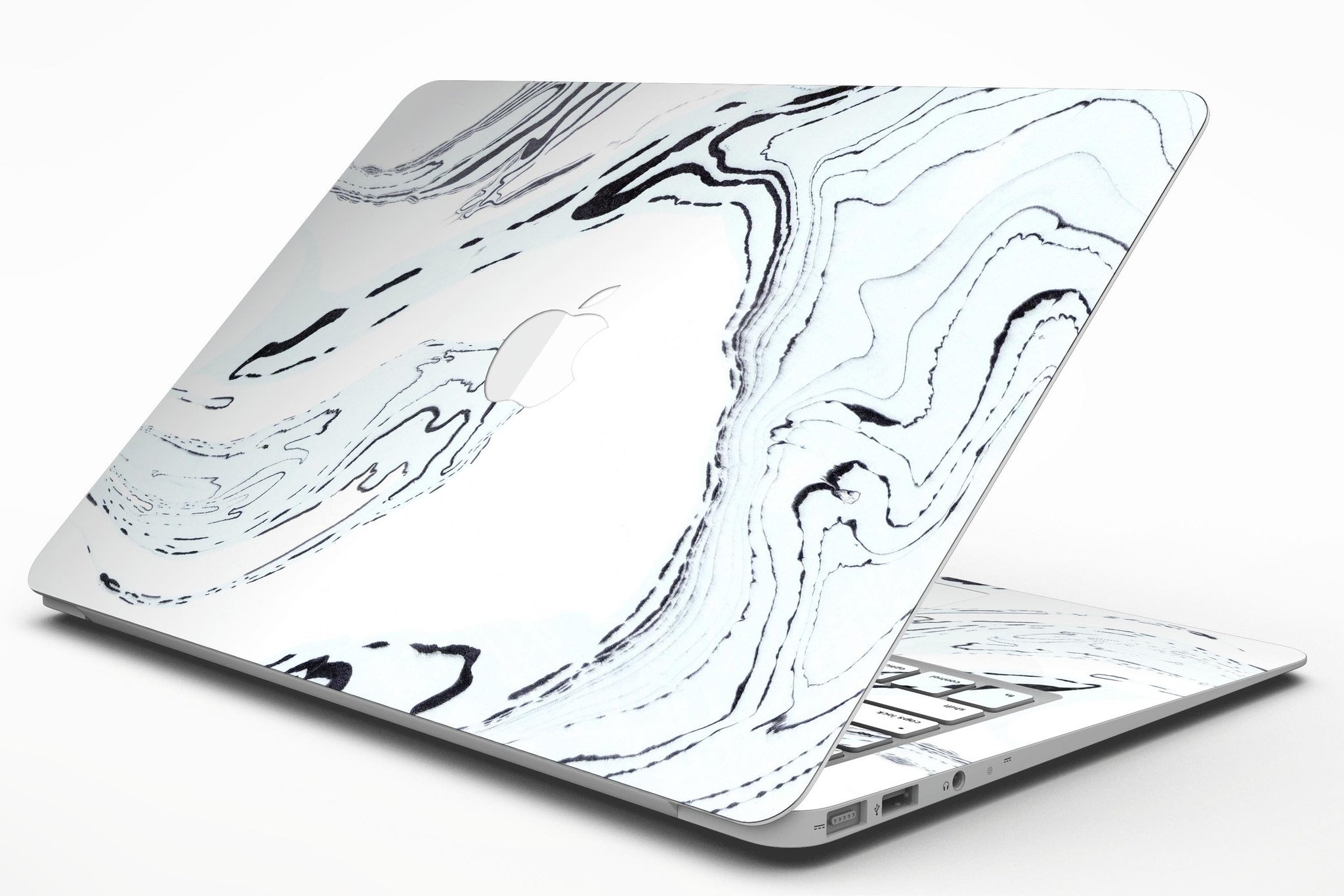 Blue 19 Textured Marble skin applied to a MacBook Air, showcasing its stylish design and premium finish.