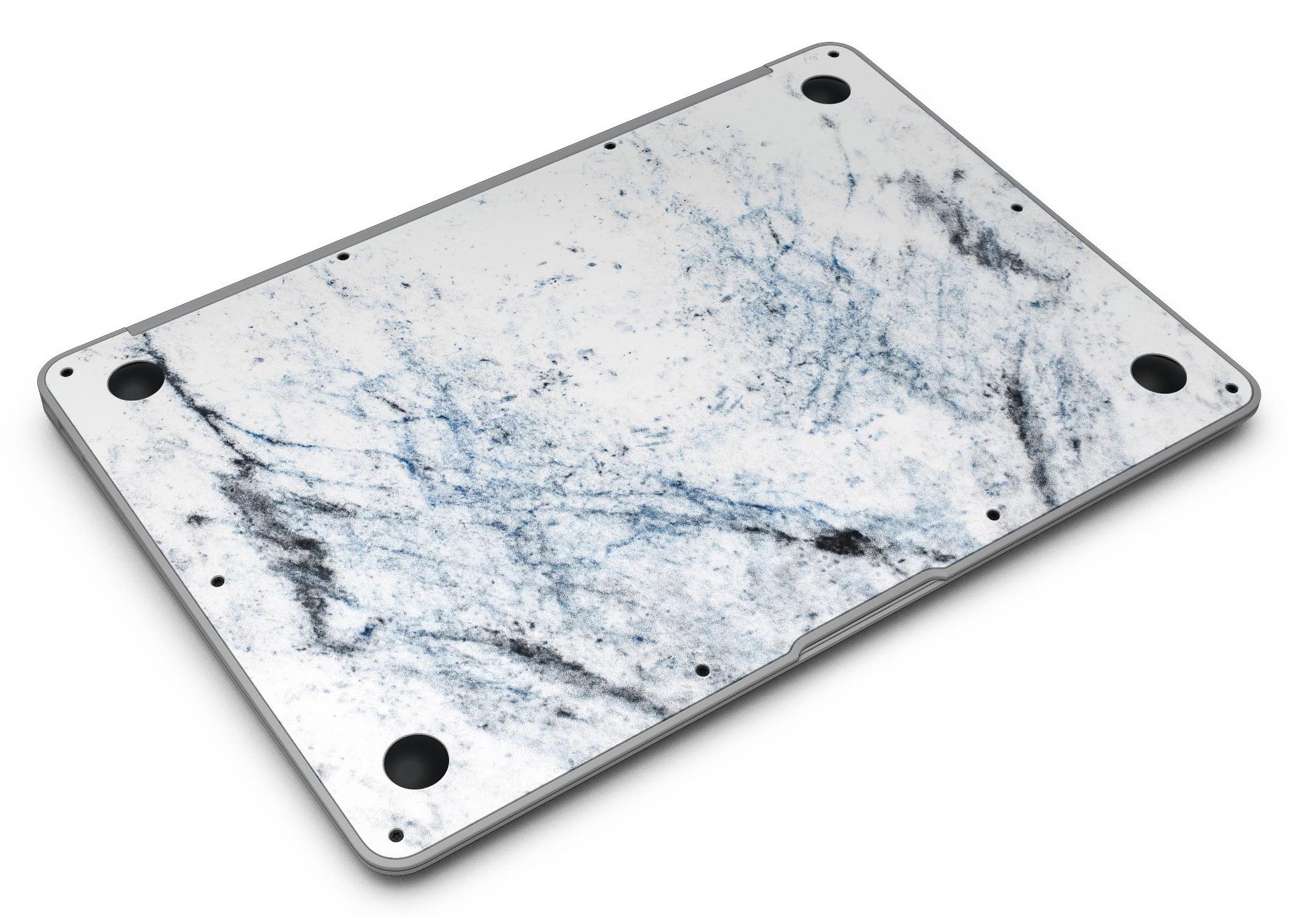 Blue and black grunge skin for MacBook Air on a white marble surface, showcasing stylish design and premium vinyl material.