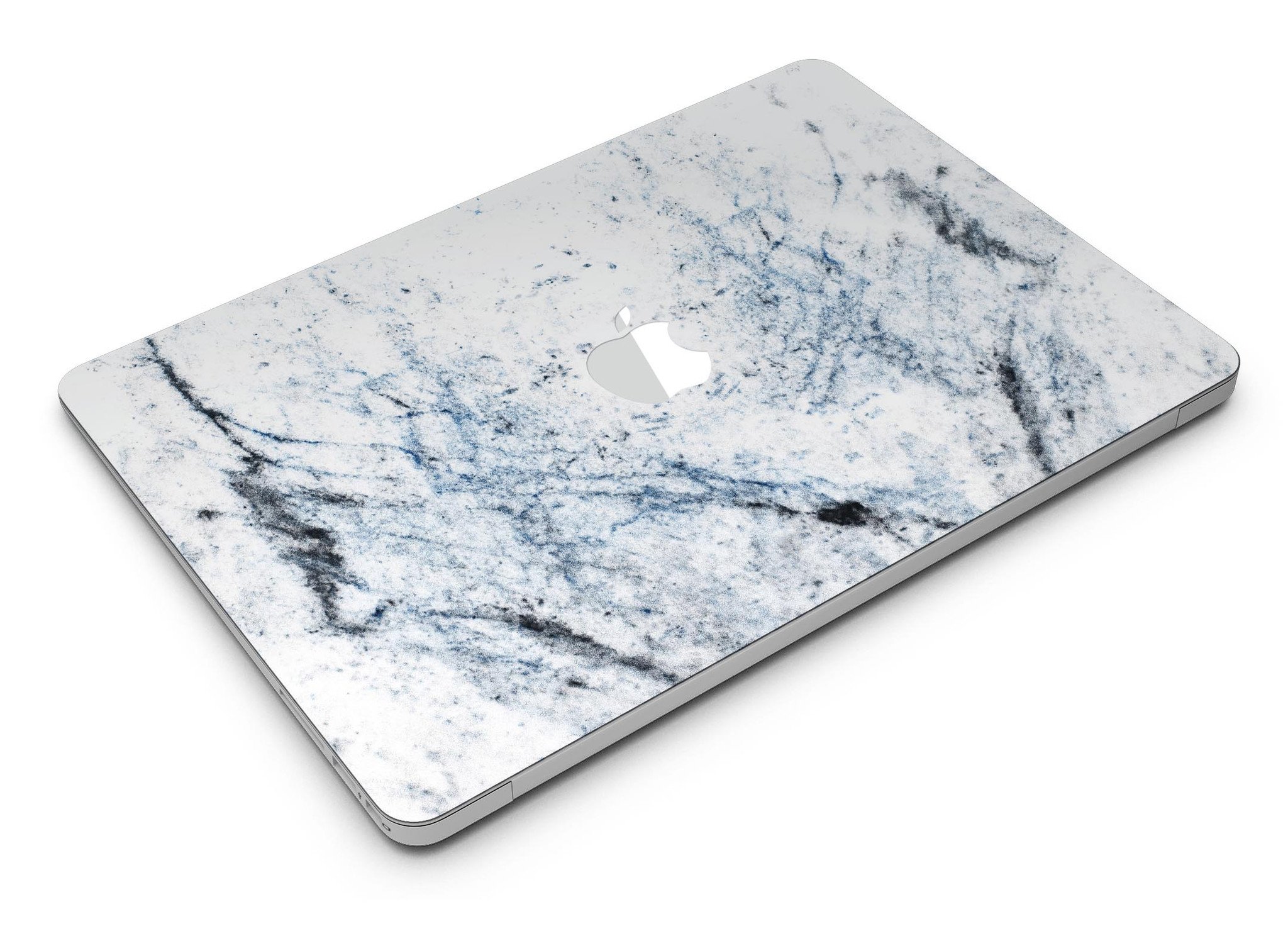 Blue and black grunge skin for MacBook Air on a white marble surface, showcasing stylish design and premium vinyl material.