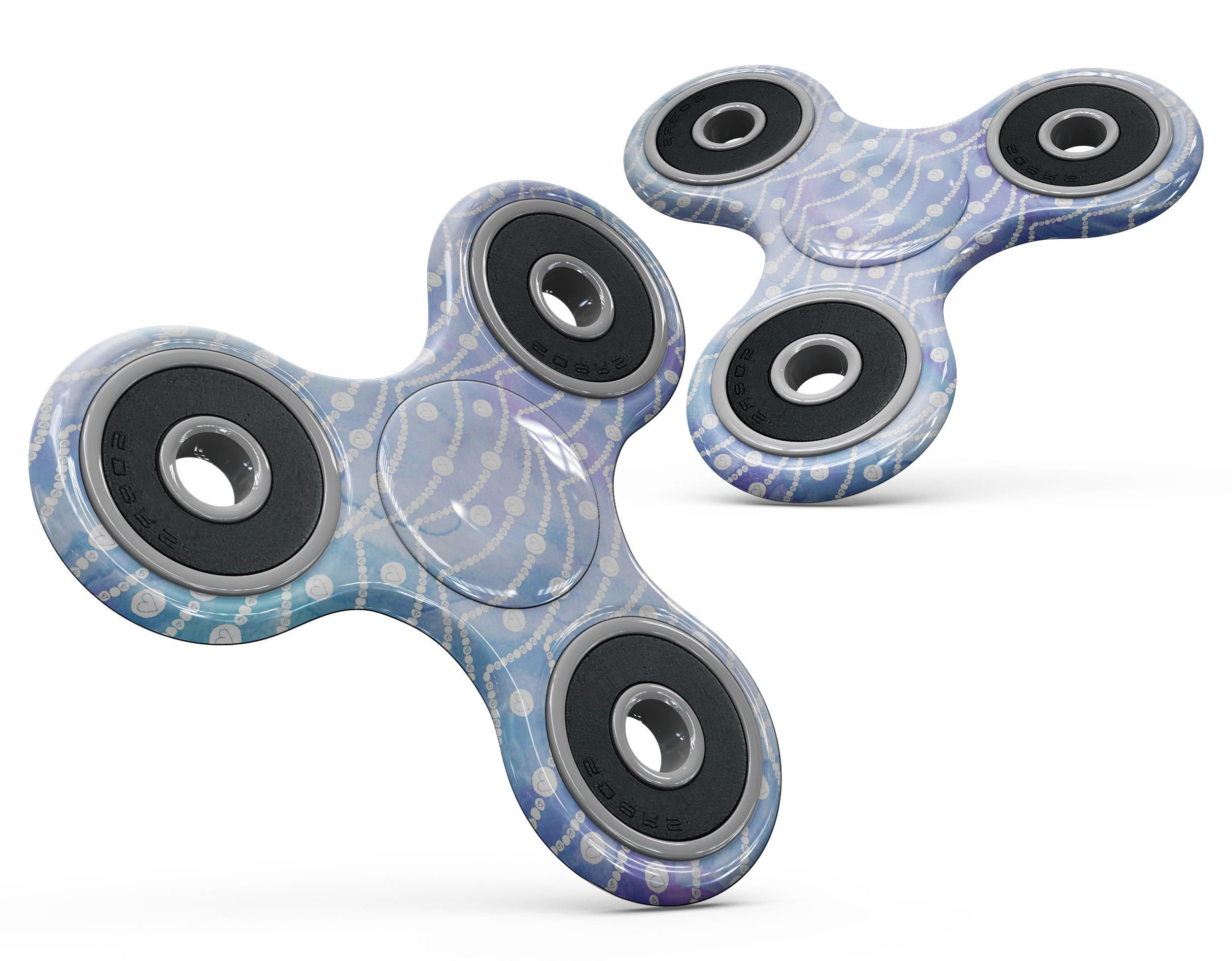 Blue and purple watercolor waves design on a fidget spinner skin kit, showcasing vibrant colors and a stylish pattern.