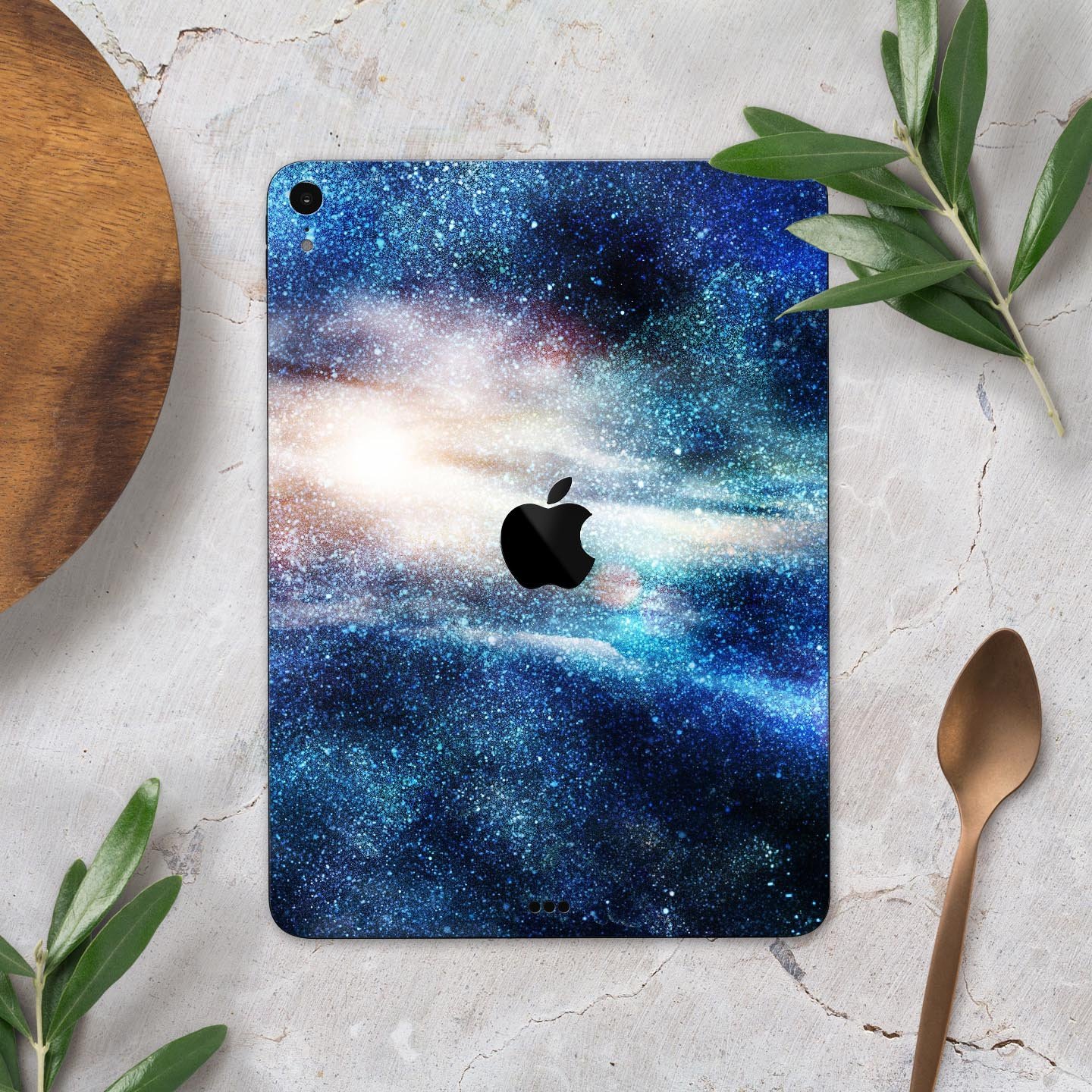 Blue and gold glowing star-wave full body skin decal for Apple devices, showcasing a vibrant design with ultra-thin protection.