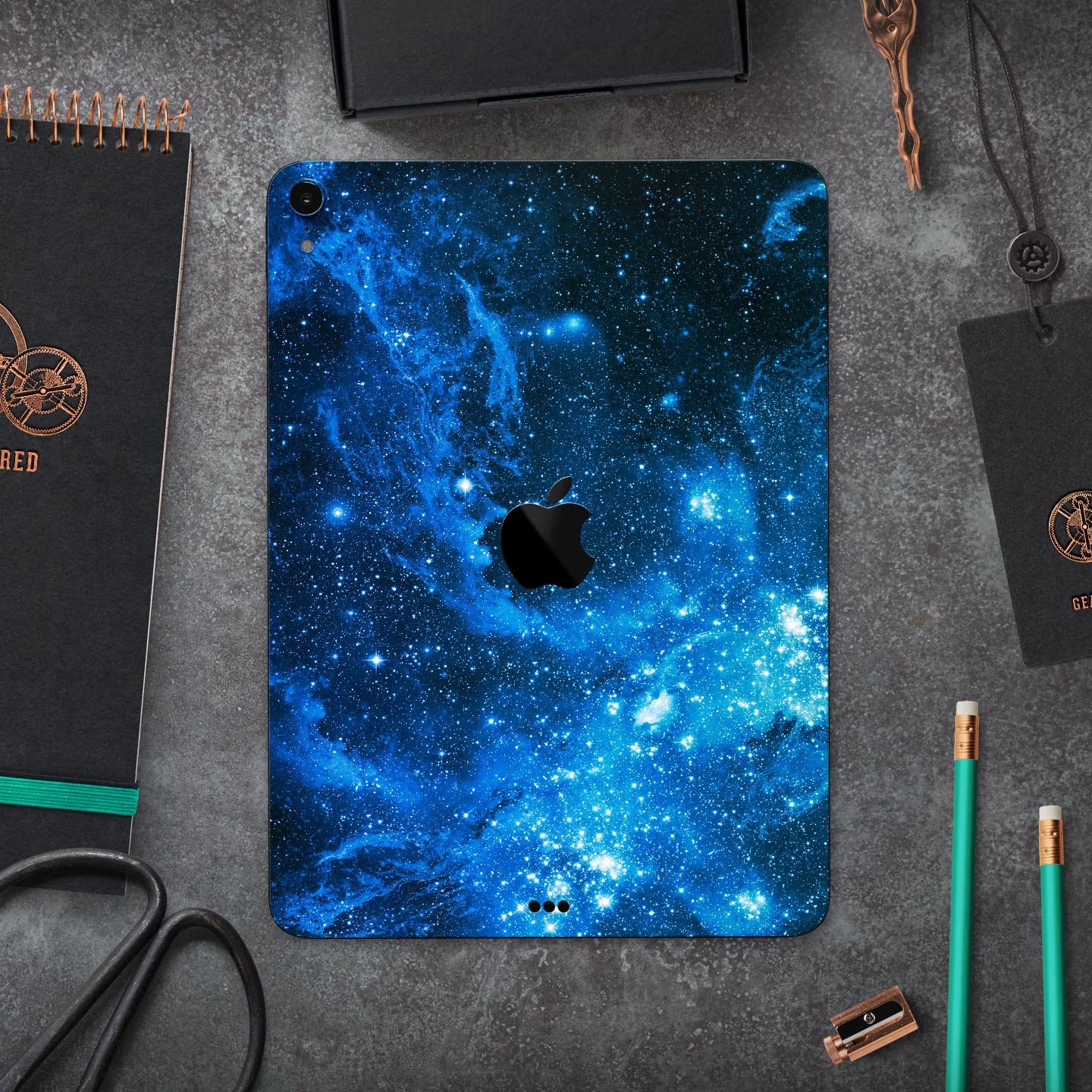 Blue Hue Nebula skin decal for Apple iPad Pro 12.9", showcasing vibrant cosmic design and premium finish.