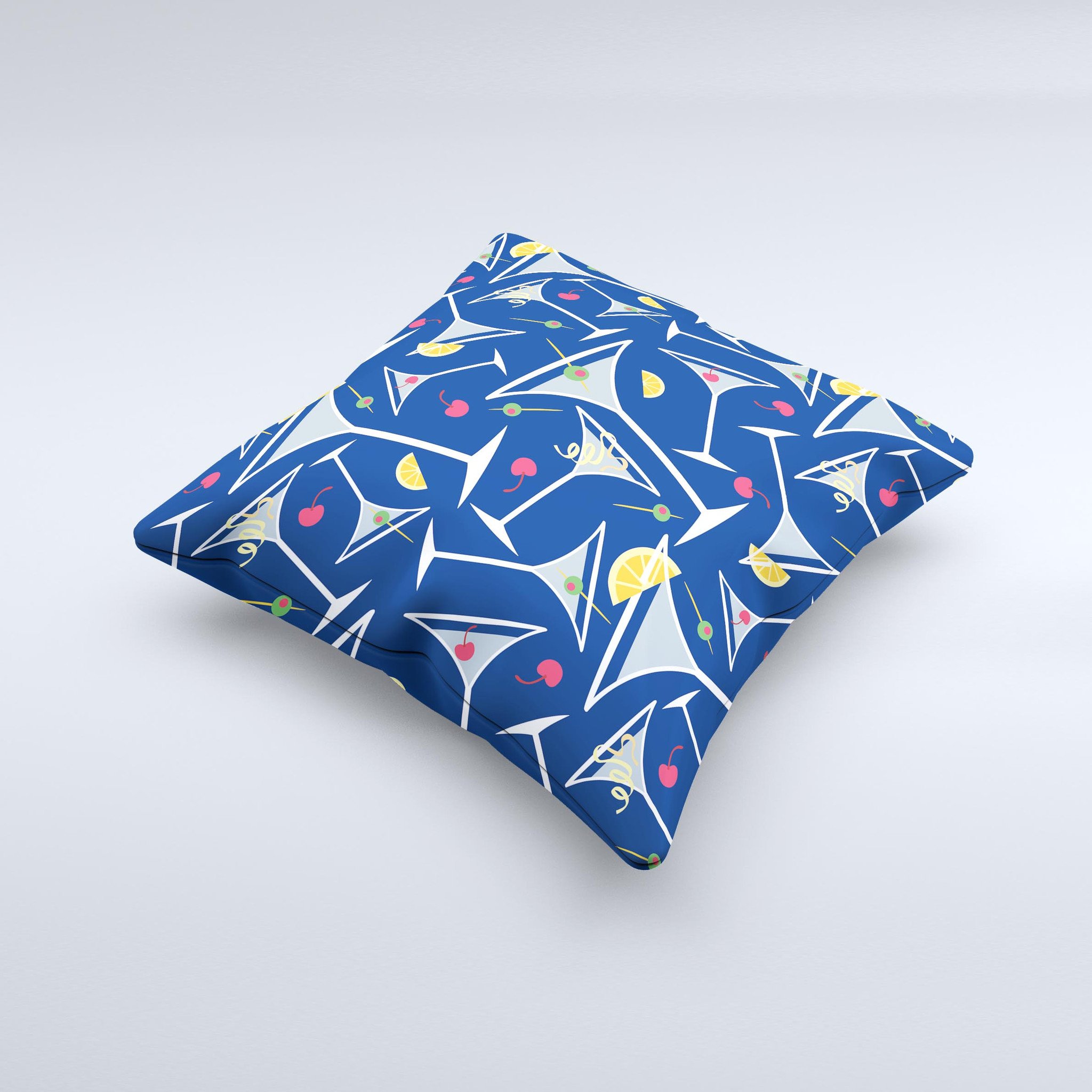 A decorative throw pillow featuring a blue martini drink with lemons, handcrafted in Virginia, showcasing vibrant colors and unique design.