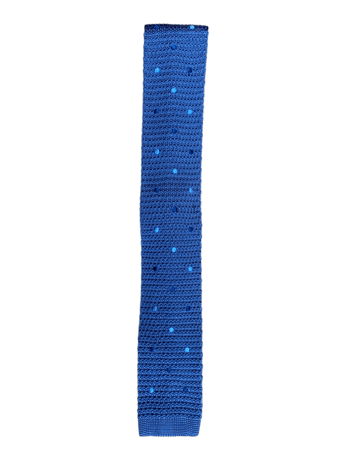 A stylish blue knitted tie featuring polka dots in midnight blue and baby blue, showcasing a square end design.