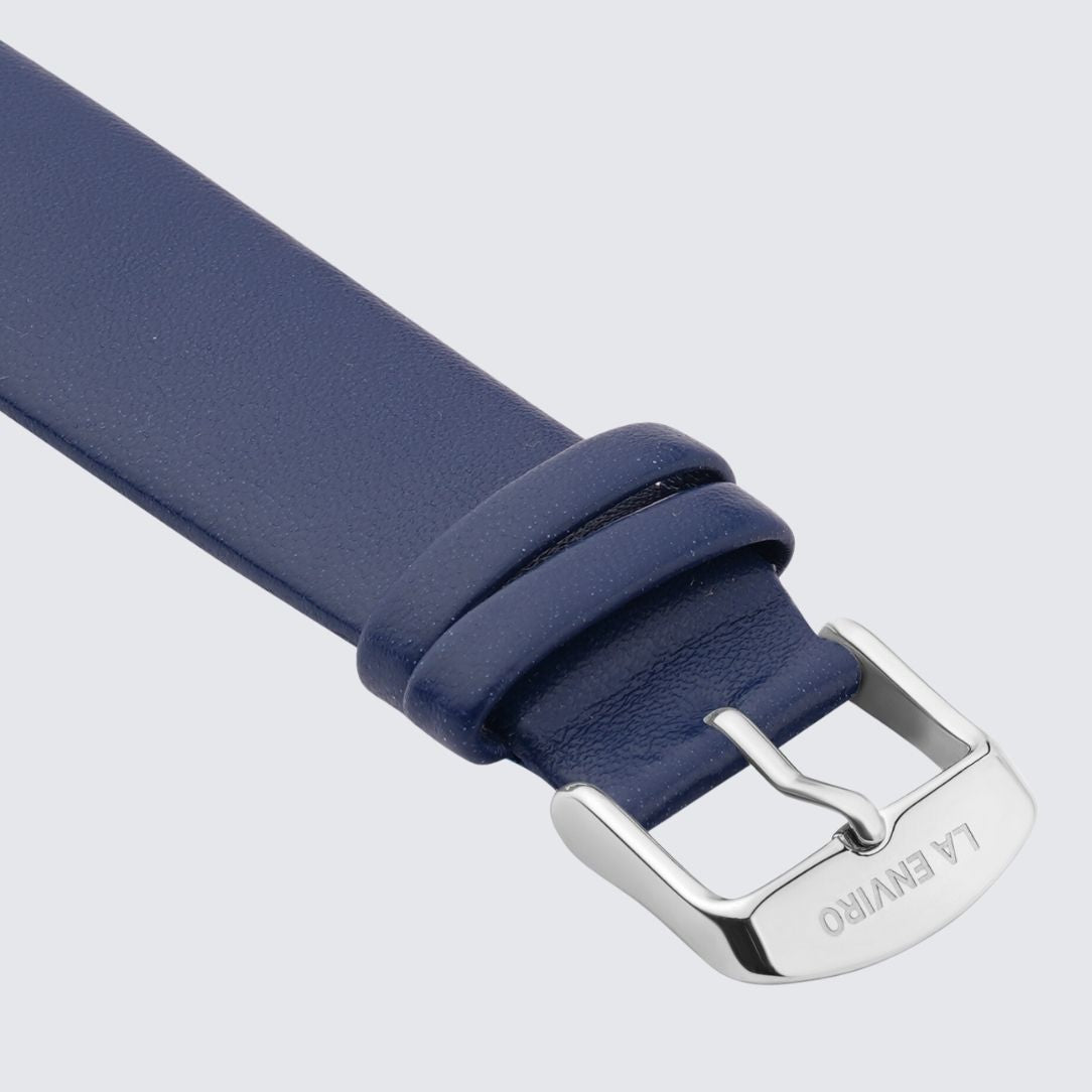 Blue Vegan Leather Unstitched Strap with stainless steel buckle, showcasing its soft texture and quick release pin feature.