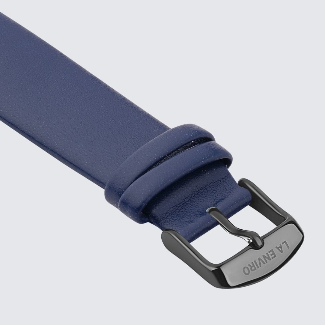 Blue Vegan Leather Unstitched Strap with stainless steel buckle, showcasing its soft texture and quick release pin feature.