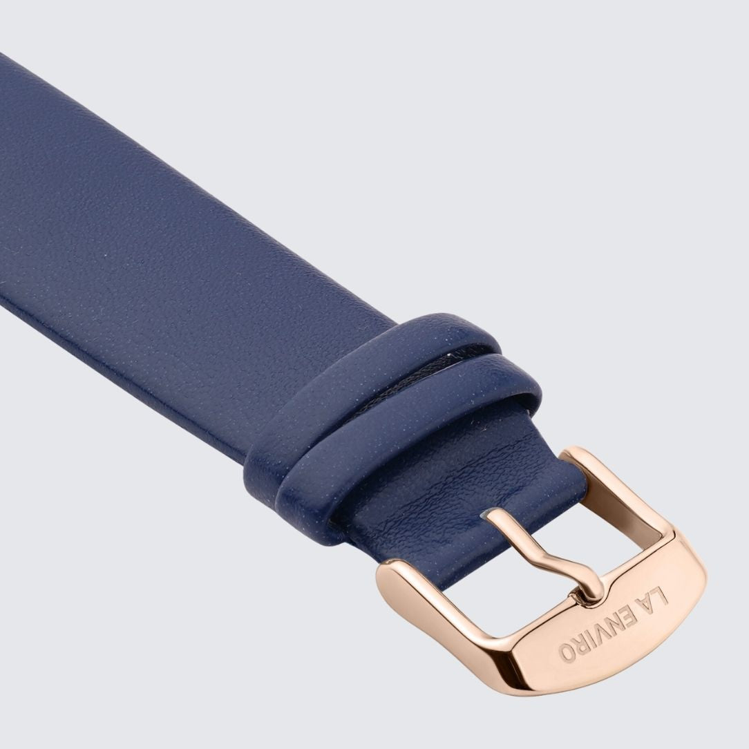 Blue Vegan Leather Unstitched Strap with stainless steel buckle, showcasing its soft texture and quick release pin feature.