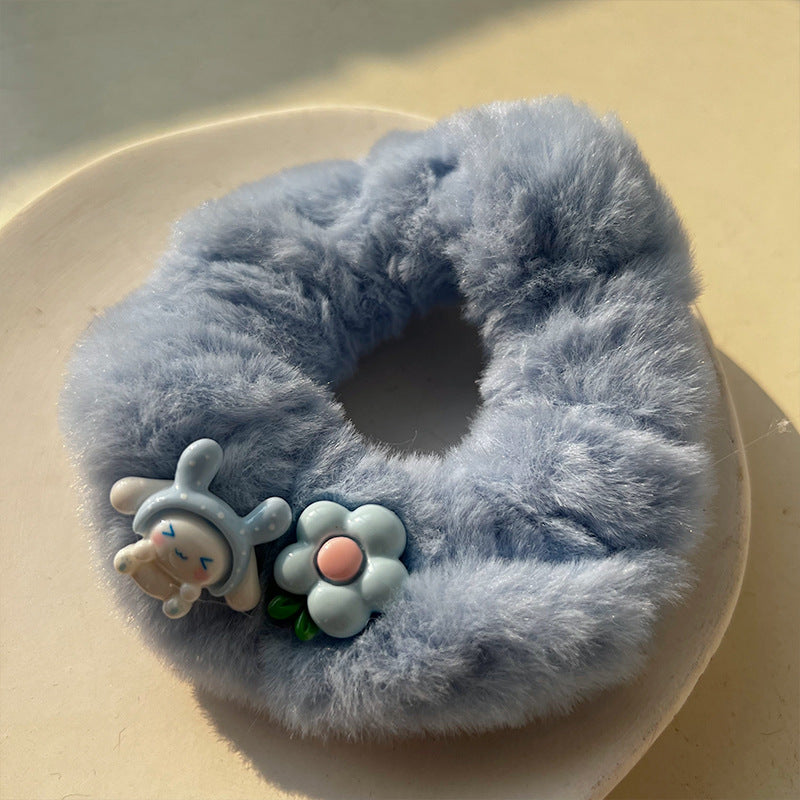 Blue and white plush hair tie featuring a cute big-eared dog design, perfect for adding charm to hairstyles.