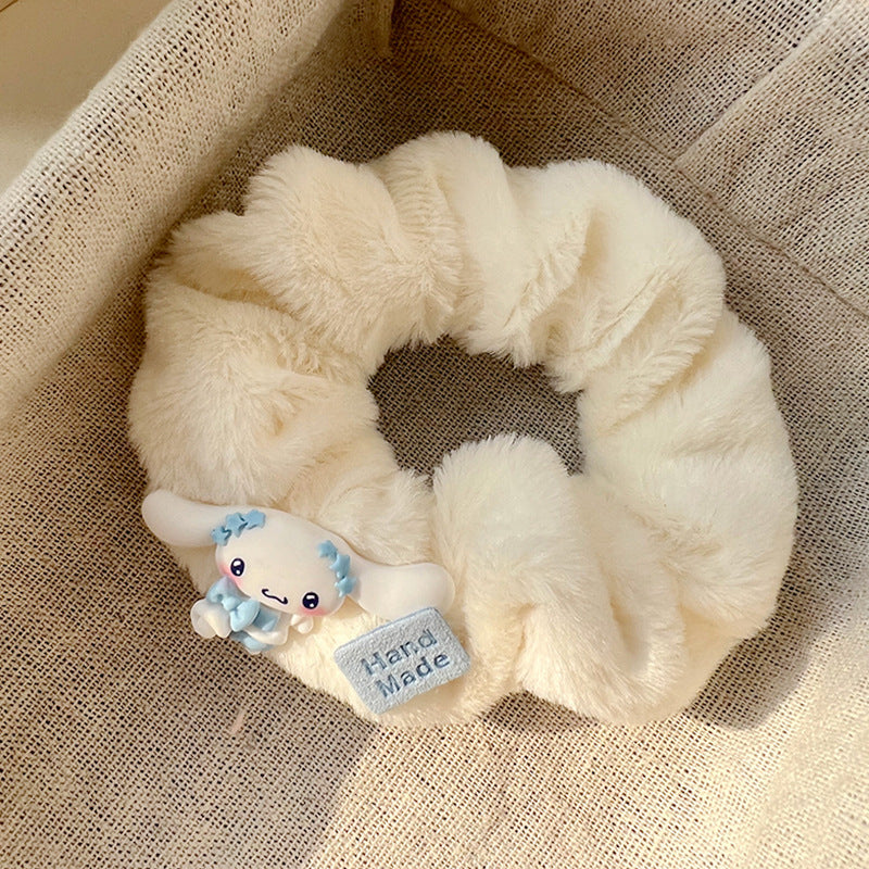 A set of five blue and white plush hair ties, showcasing different stylish designs for versatile hairstyles.