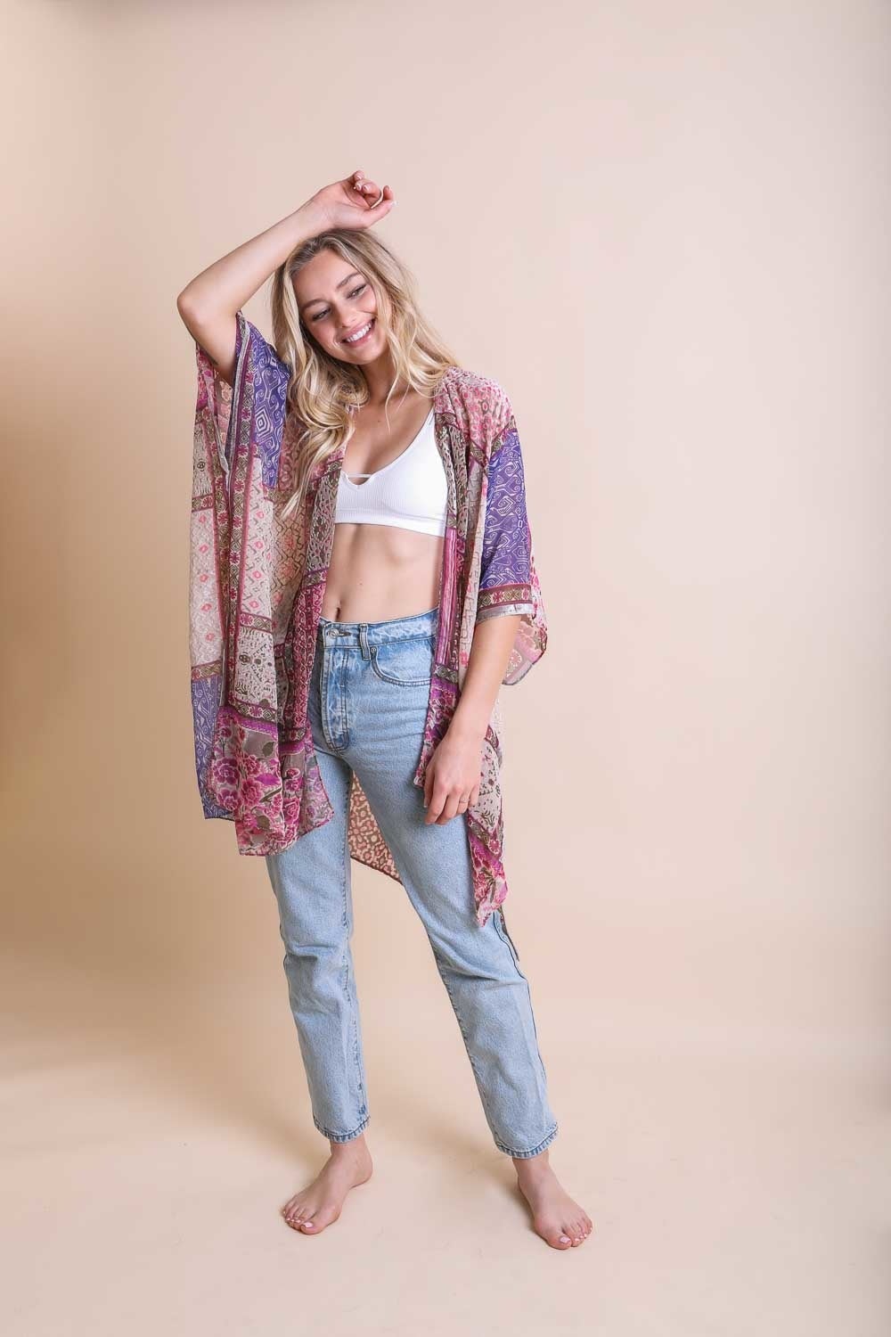 A stylish Bohemian Burnout Velvet Kimono featuring bold prints and luxurious velvet fabric, perfect for layering.