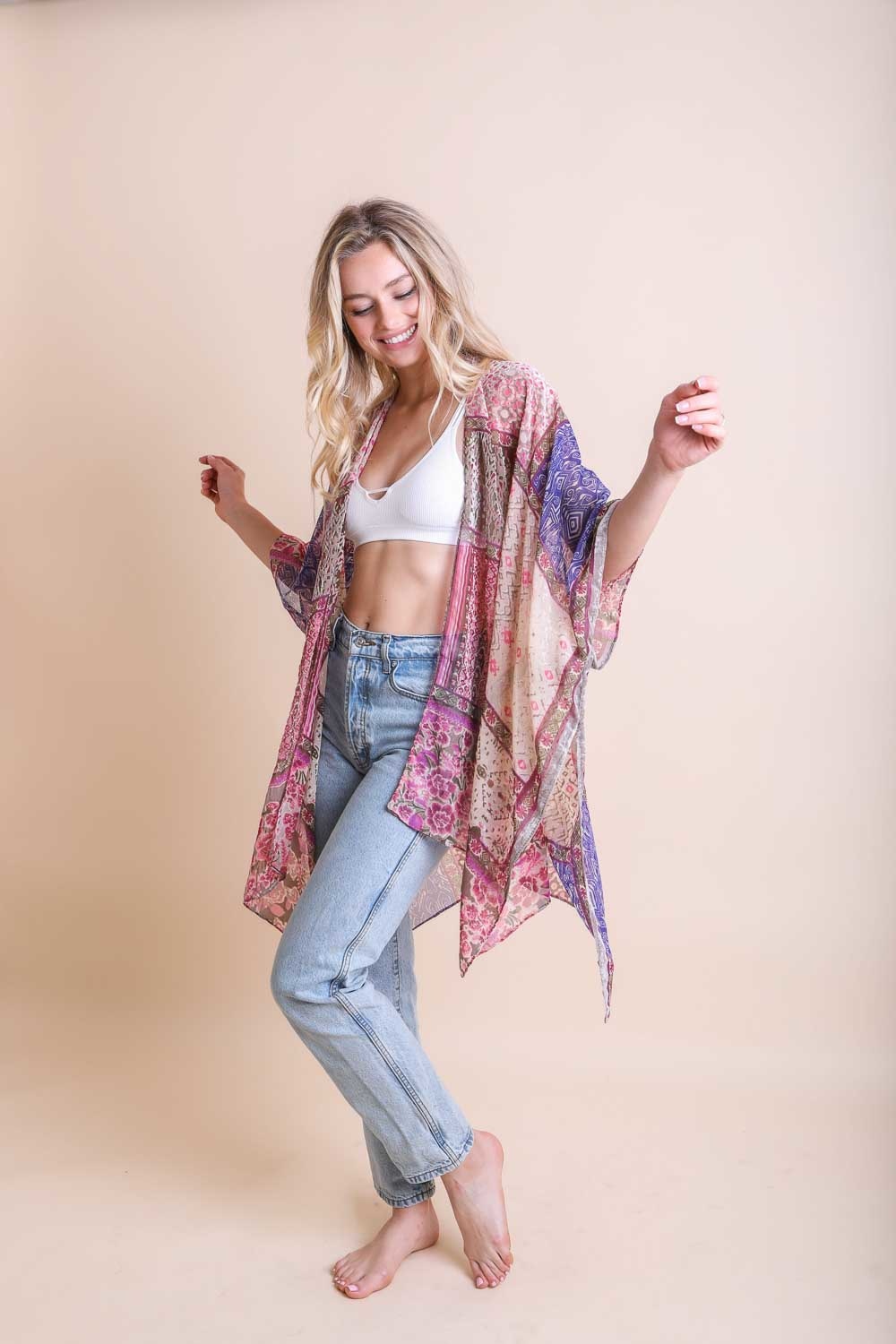 A stylish Bohemian Burnout Velvet Kimono featuring bold prints and luxurious velvet fabric, perfect for layering.