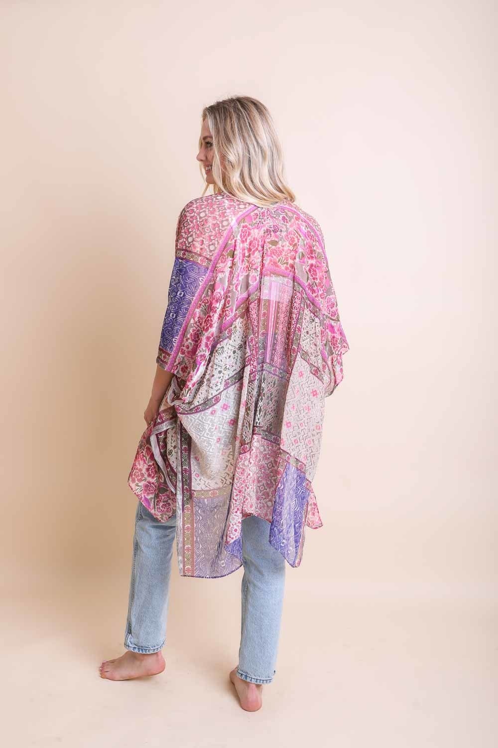 A stylish Bohemian Burnout Velvet Kimono featuring bold prints and luxurious velvet fabric, perfect for layering.