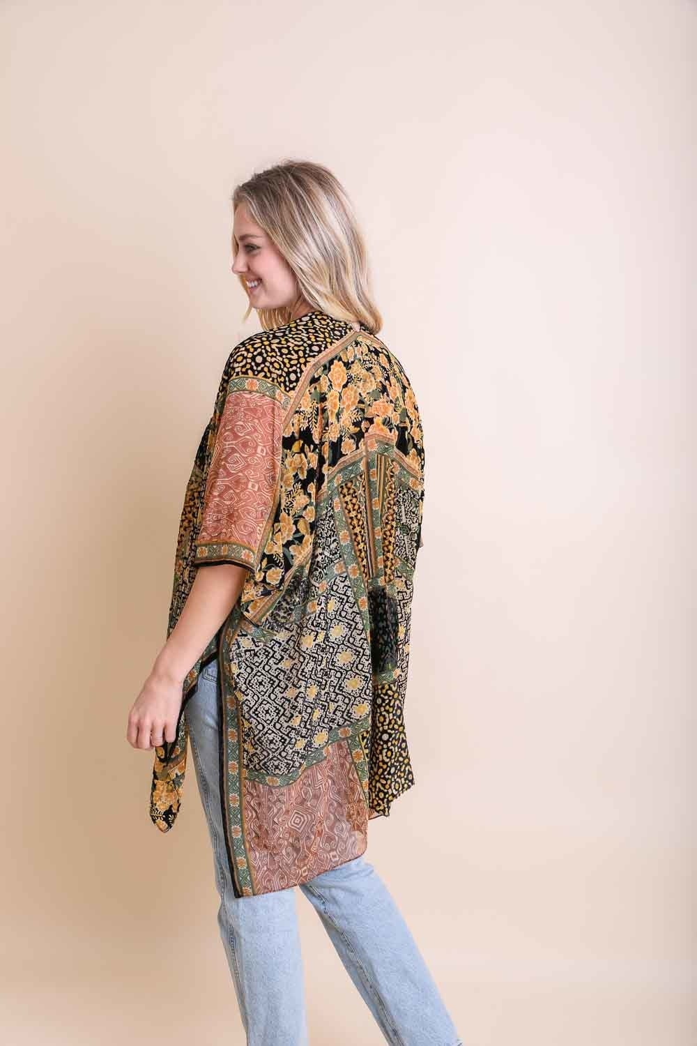 A stylish Bohemian Burnout Velvet Kimono featuring bold prints and luxurious velvet fabric, perfect for layering.