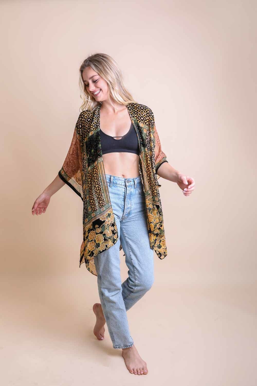 A stylish Bohemian Burnout Velvet Kimono featuring bold prints and luxurious velvet fabric, perfect for layering.