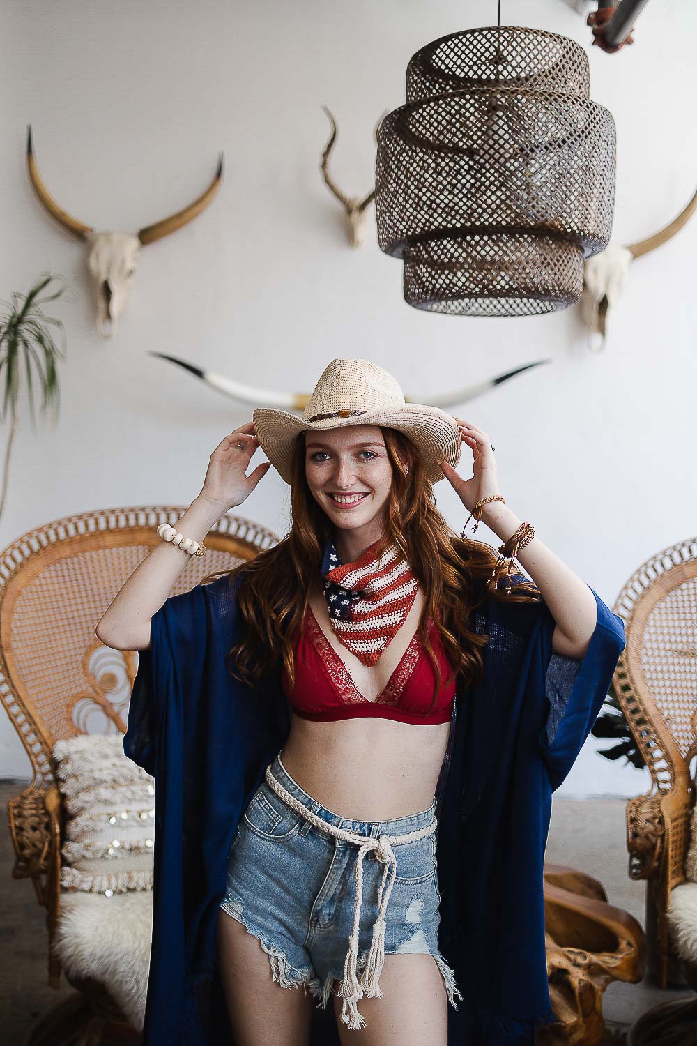 A stylish Boho Outback Hat featuring a whimsical bead chain detail, wide brim for sun protection, and lightweight paper construction, perfect for summer outings.