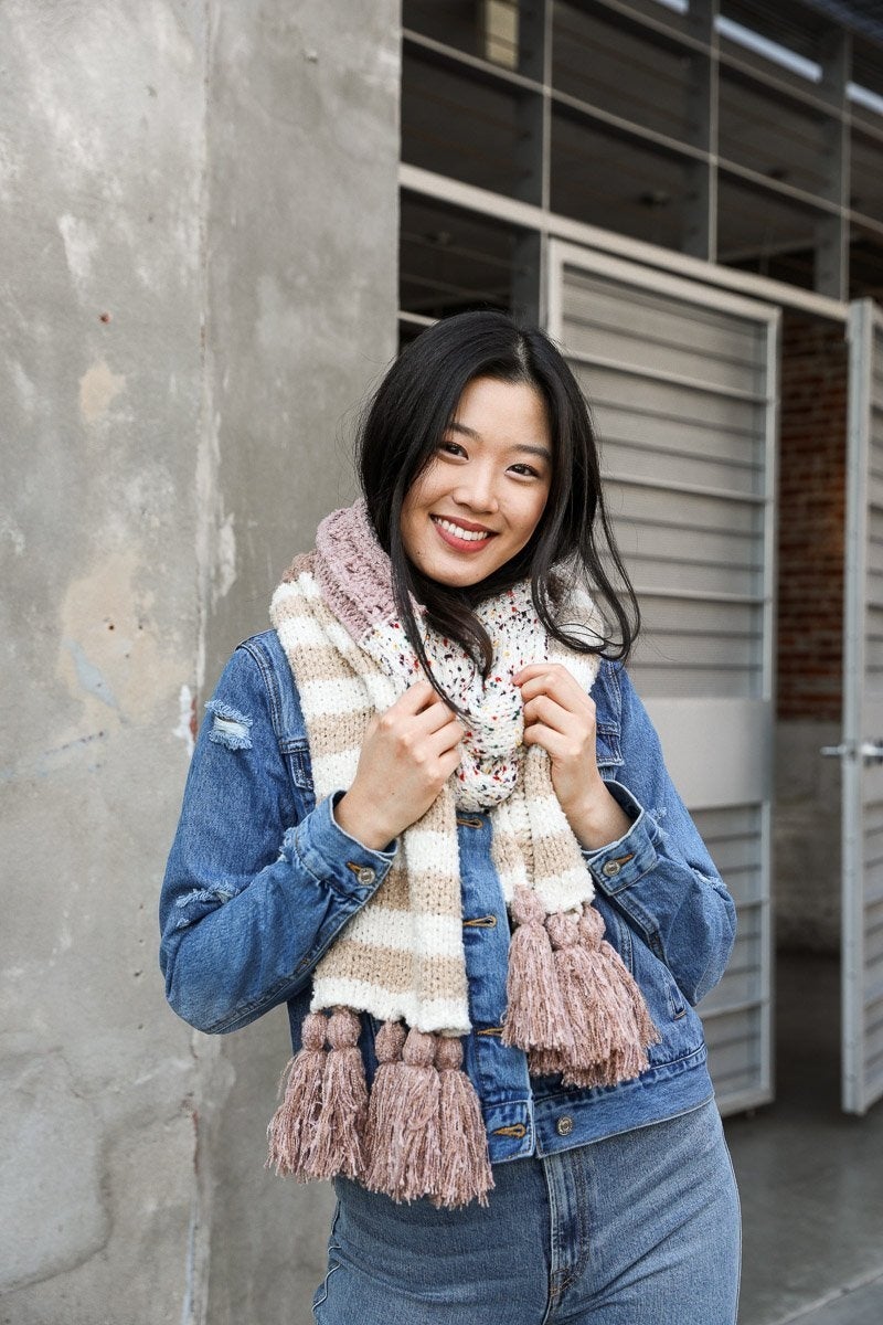 Boho Speckle Stripe Tassel Scarf featuring a unique speckle pattern and playful tassels, showcasing its cozy and stylish design.