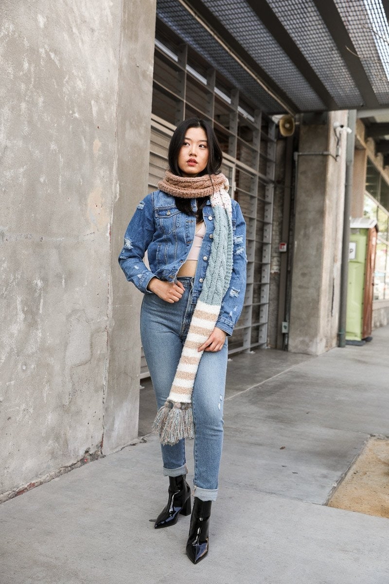 Boho Speckle Stripe Tassel Scarf featuring a unique speckle pattern and playful tassels, showcasing its cozy and stylish design.