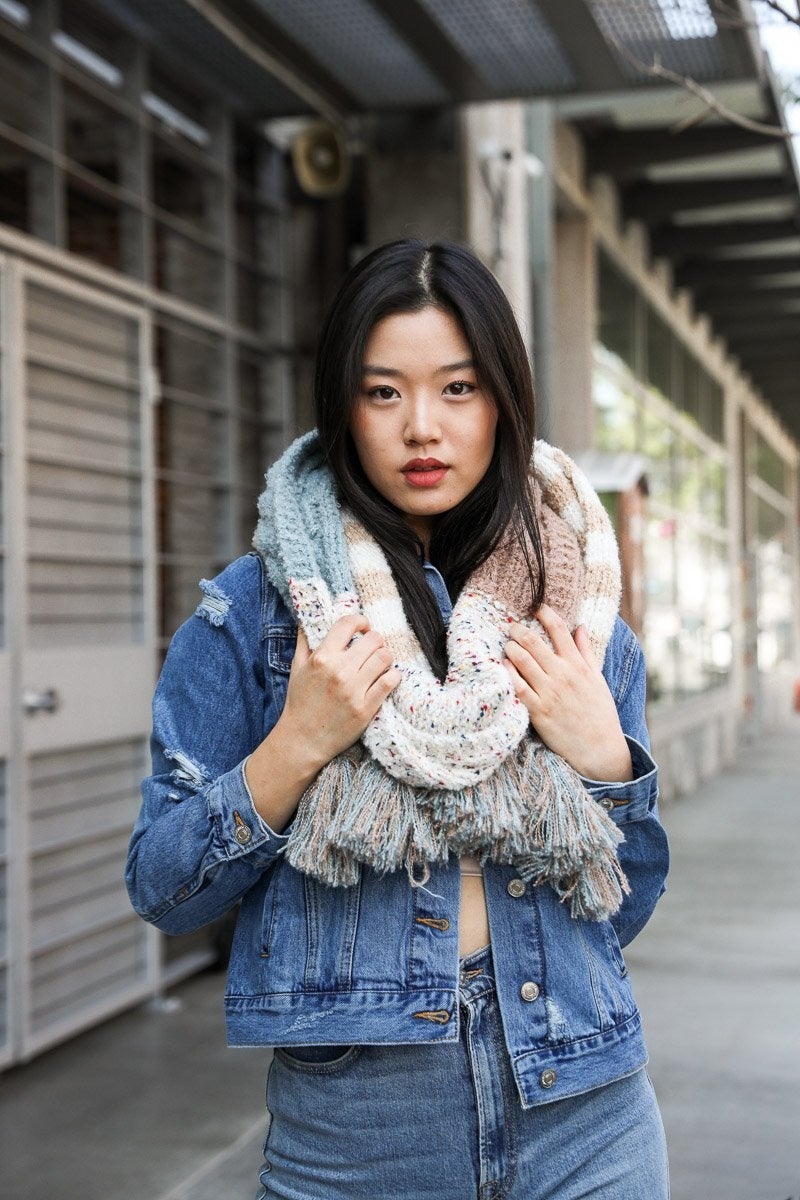 Boho Speckle Stripe Tassel Scarf featuring a unique speckle pattern and playful tassels, showcasing its cozy and stylish design.