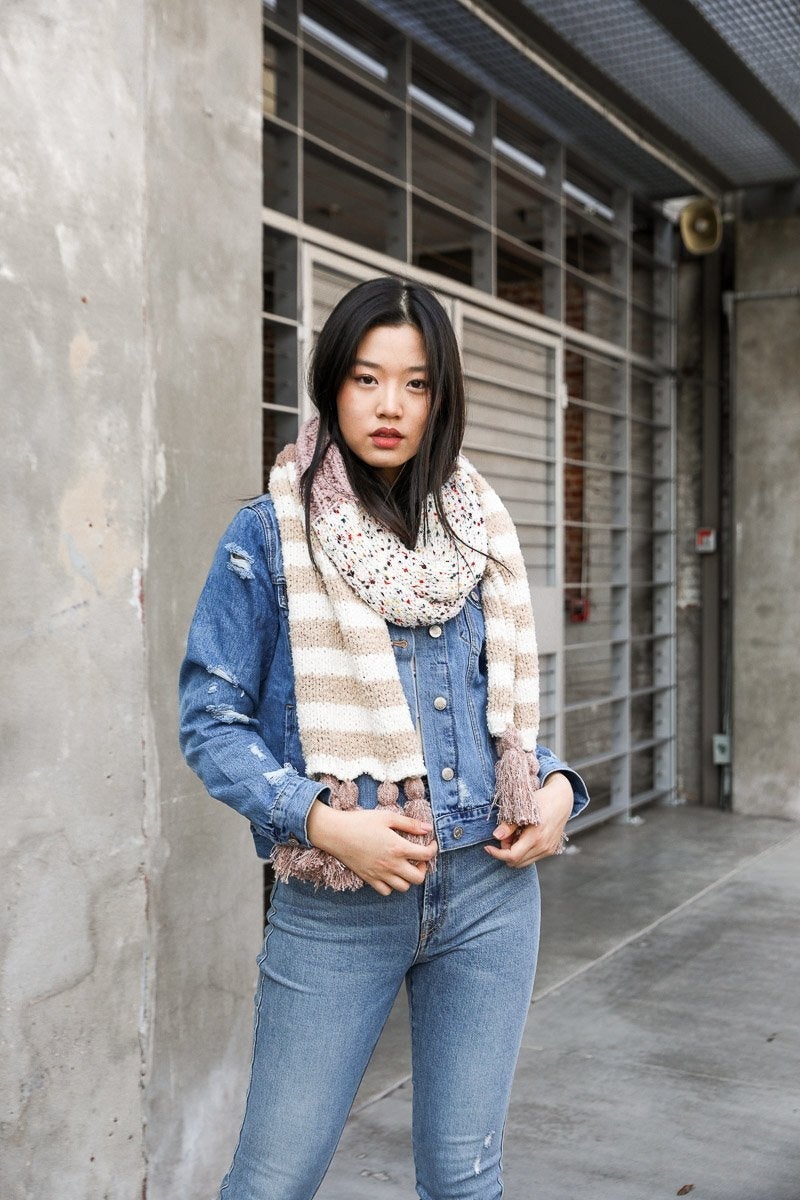 Boho Speckle Stripe Tassel Scarf featuring a unique speckle pattern and playful tassels, showcasing its cozy and stylish design.