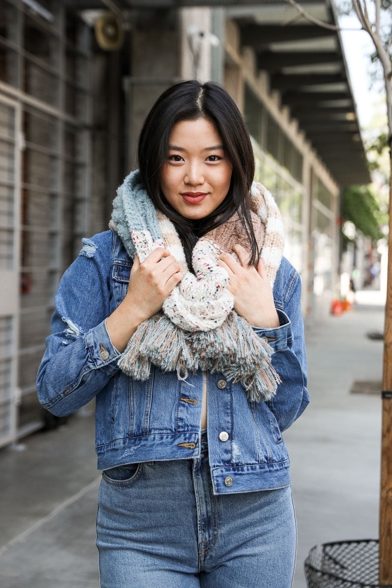 Boho Speckle Stripe Tassel Scarf featuring a unique speckle pattern and playful tassels, showcasing its cozy and stylish design.