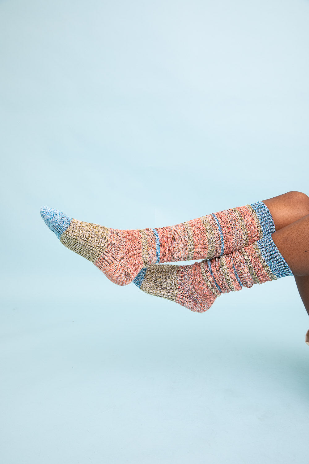 Cozy Boho Stripe Boot Socks in vibrant colors, perfect for winter wear.