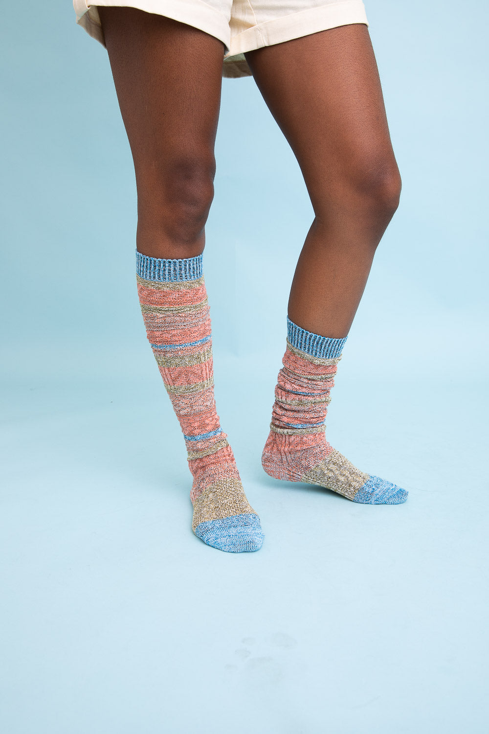 Cozy Boho Stripe Boot Socks in vibrant colors, perfect for winter wear.