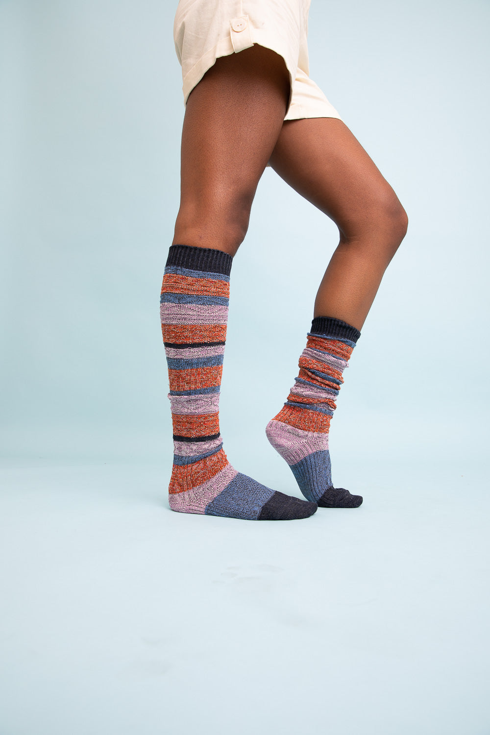 Cozy Boho Stripe Boot Socks in vibrant colors, perfect for winter wear.