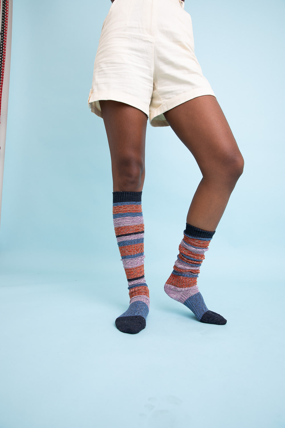 Cozy Boho Stripe Boot Socks in vibrant colors, perfect for winter wear.