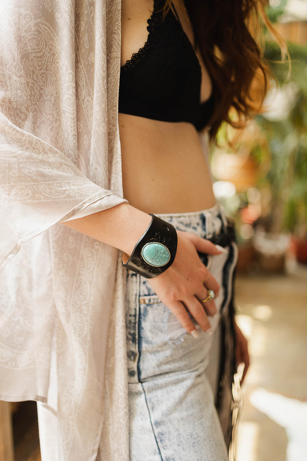 A stylish Boho Turquoise Stone Leather Cuff bracelet featuring a vibrant turquoise stone set on a soft leather band.