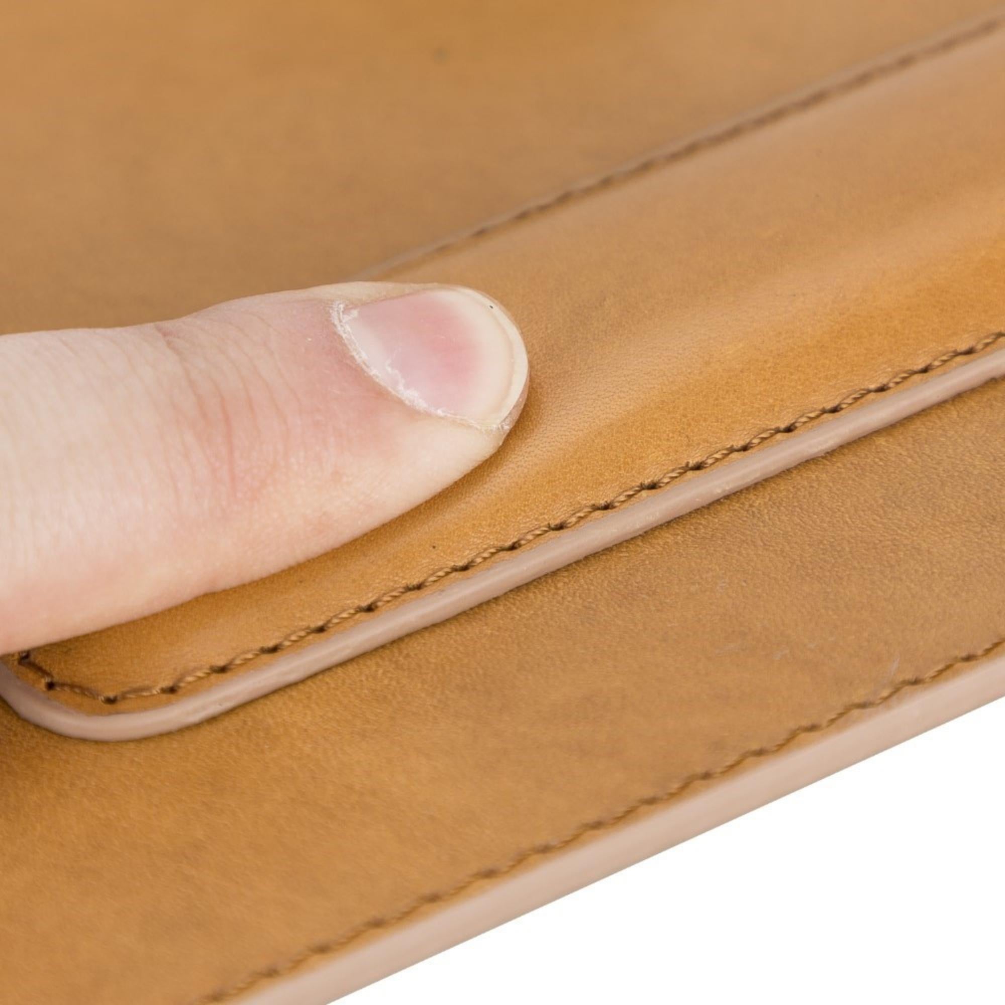 Boulder Full-Grain Leather Mouse Pad with ergonomic hand support, showcasing its luxurious texture and non-slip base.