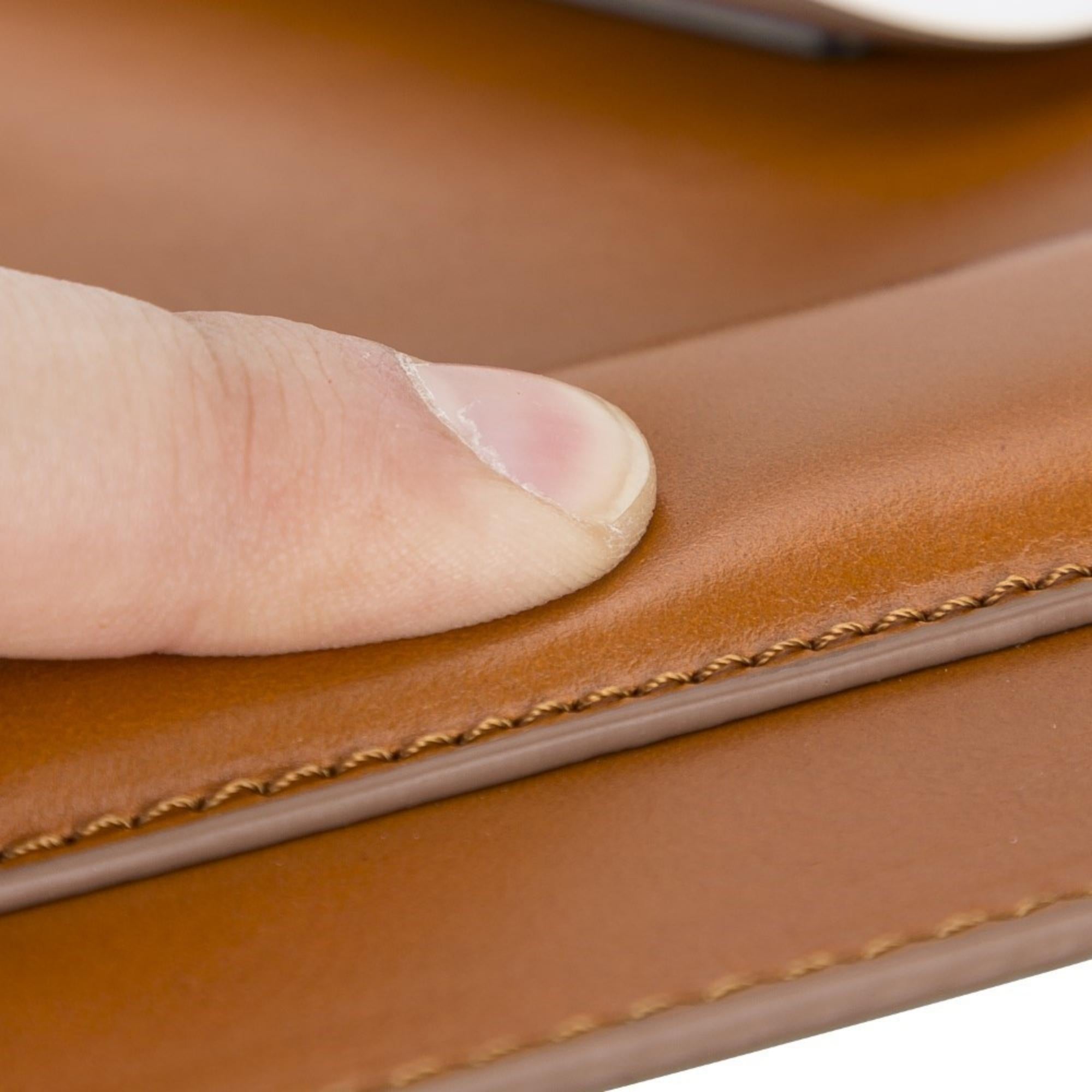 Boulder Full-Grain Leather Mouse Pad with ergonomic hand support, showcasing its luxurious texture and non-slip base.