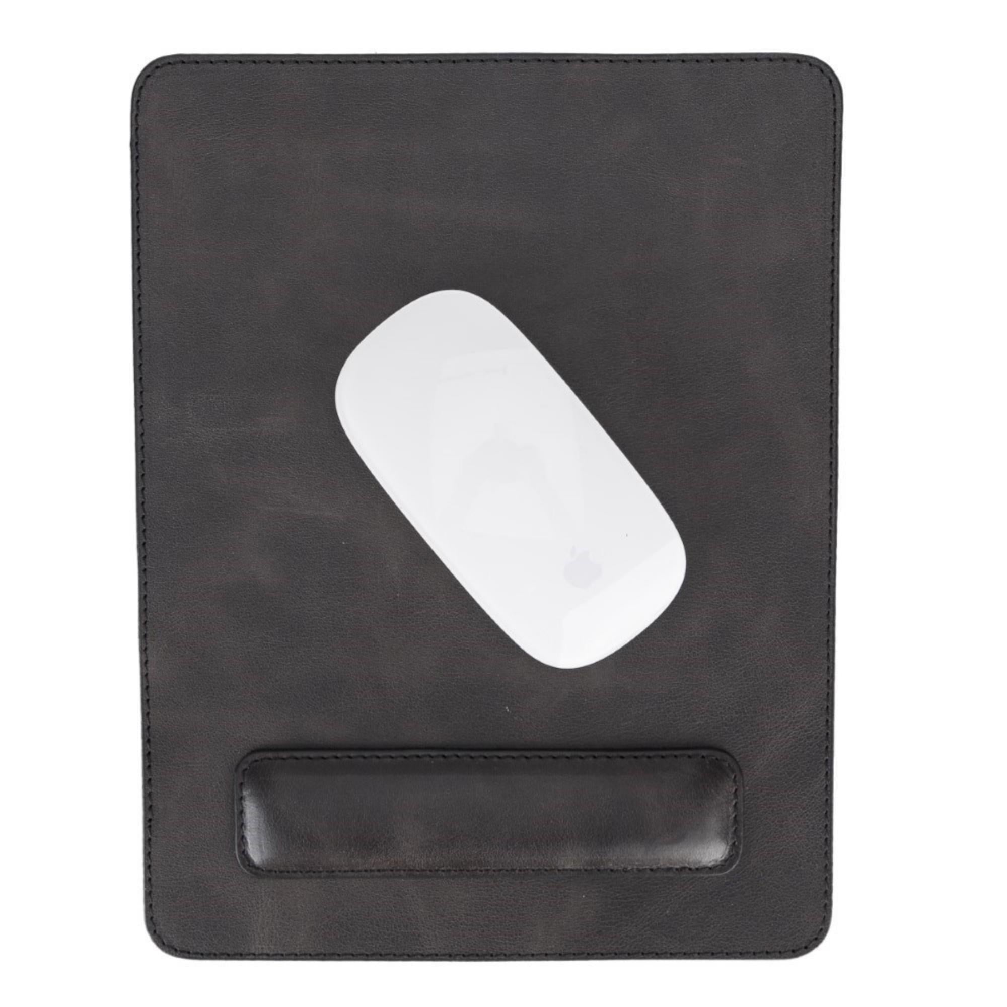 Boulder Full-Grain Leather Mouse Pad with ergonomic hand support, showcasing its luxurious texture and non-slip base.